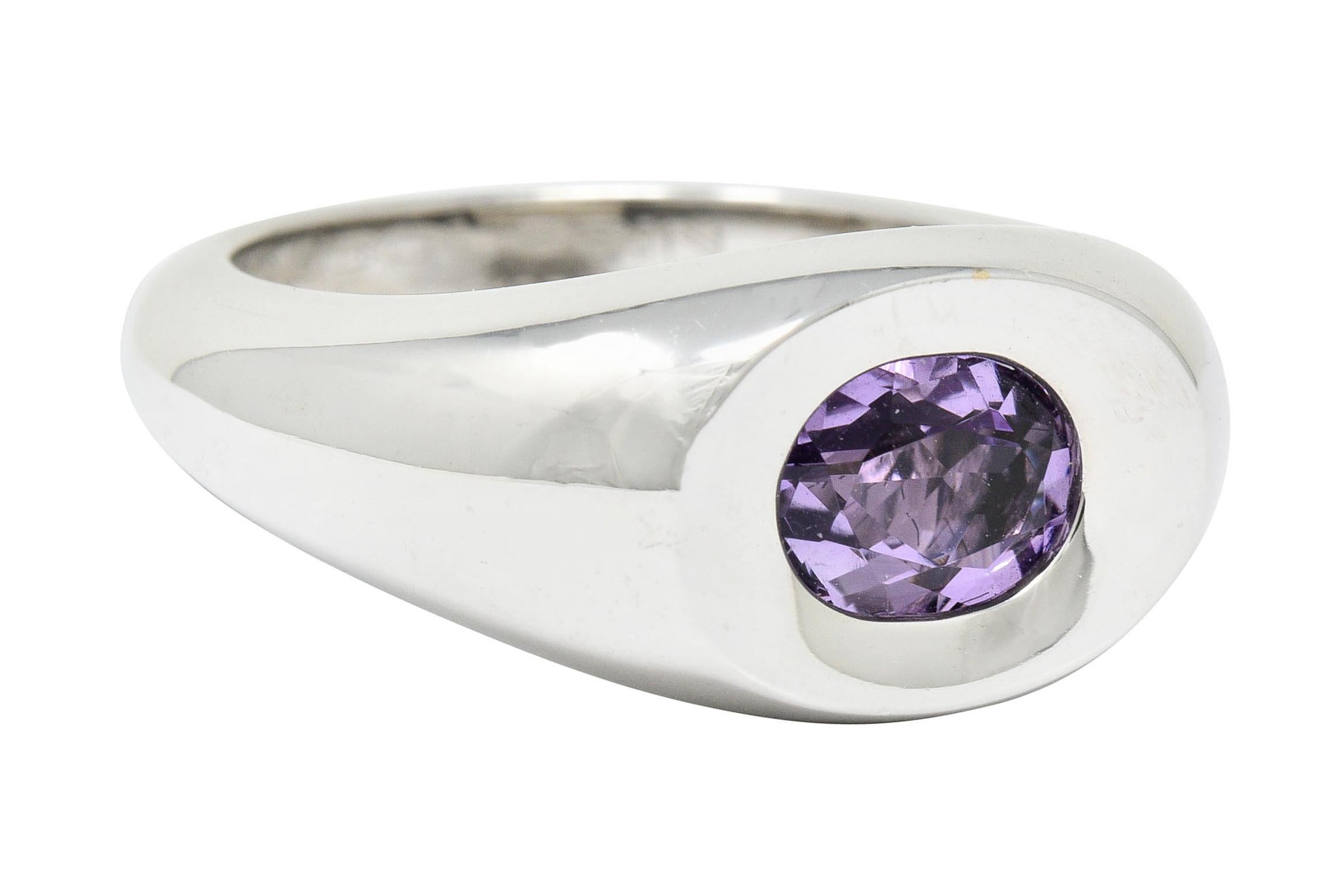 Polished white gold bombé style band ring with a concave top

Featuring a flush set oval cut amethyst measuring approximately 7.3 x 5.5 mm; lavender in color

Numbered, fully signed Mauboussin Paris, and with maker's mark

Stamped 750 and with