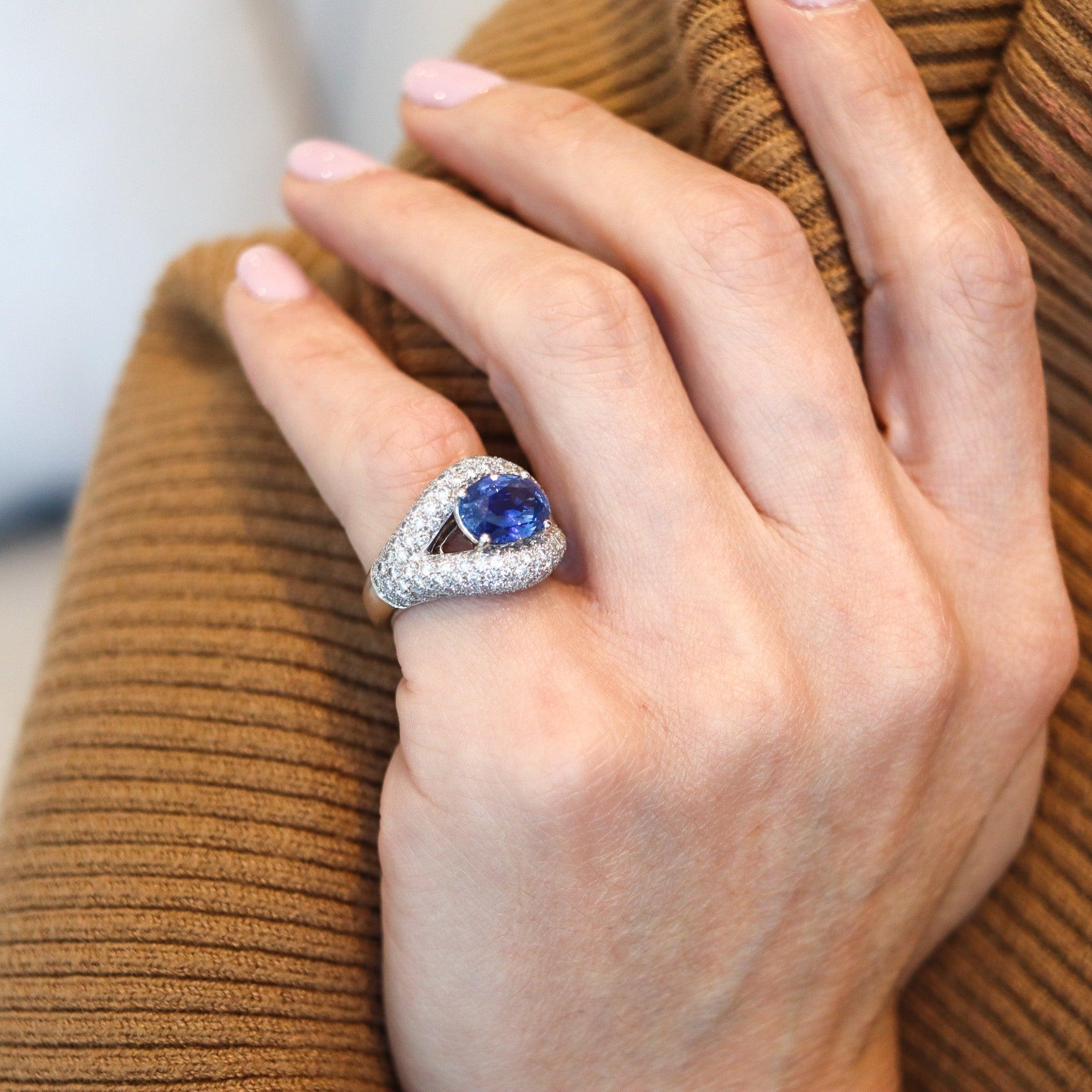 Gia certified sapphire cocktail ring designed by Mauboussin.

This is a fabulous gem set cocktail ring created in Paris France by the jewelry house of Mauboussin, back in the late 1980. The cocktail ring has been masterfully crafted with classic