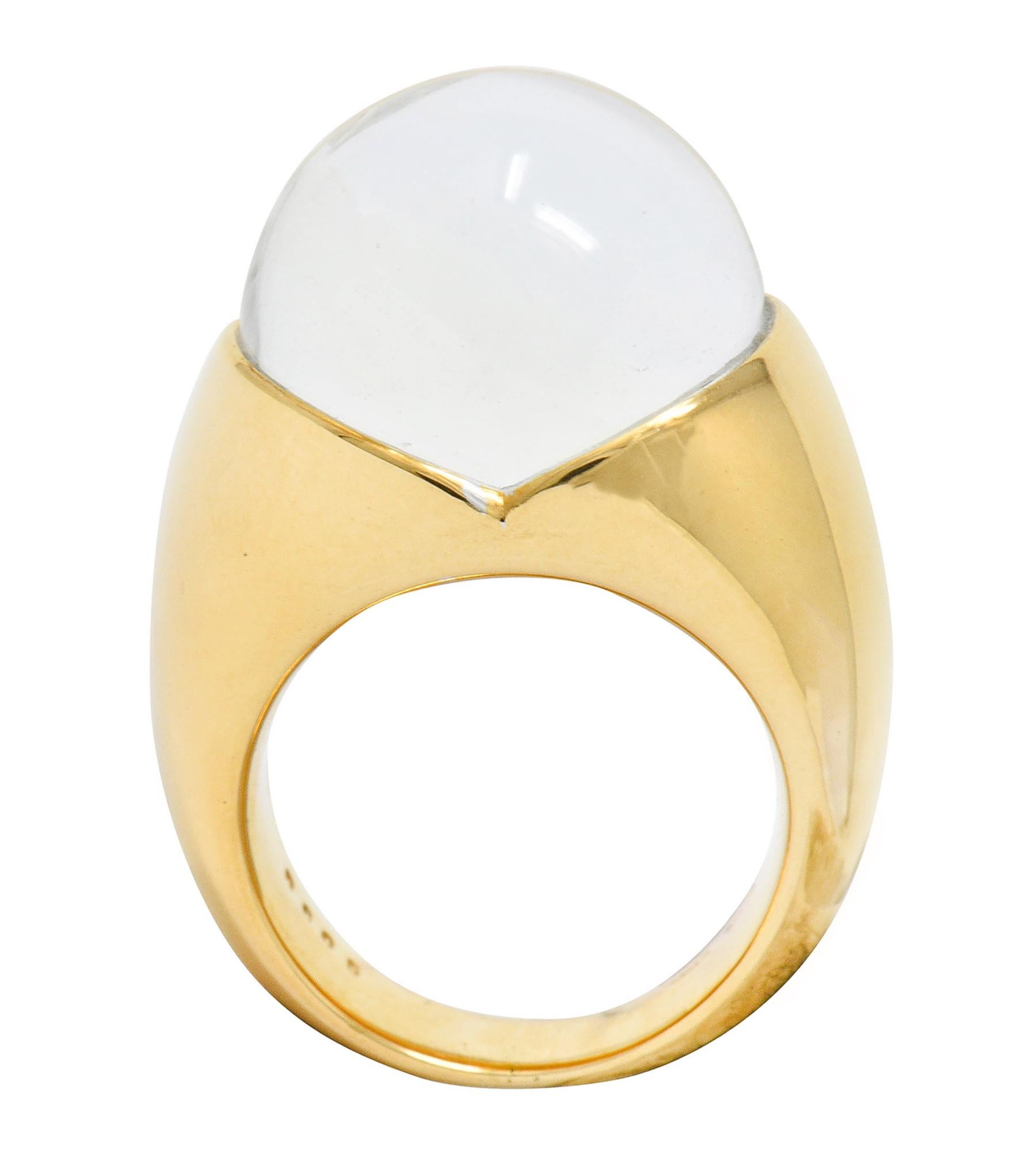 Featuring a rock crystal sphere measuring approximately 15.6 mm

Nestled securely in a high polished gold mounting atop a flush set round brilliant cut diamond

Its size is magnified through the well polished and transparent rock crystal

Stamped