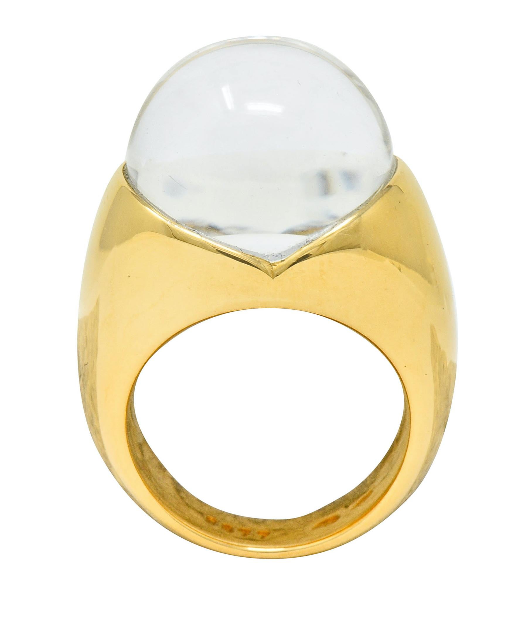 Featuring a rock crystal sphere measuring approximately 15.6 mm, nestled securely in a high polished gold mounting

Crystal ball rests atop a round brilliant cut diamond, its size is magnified through the well polished and transparent rock