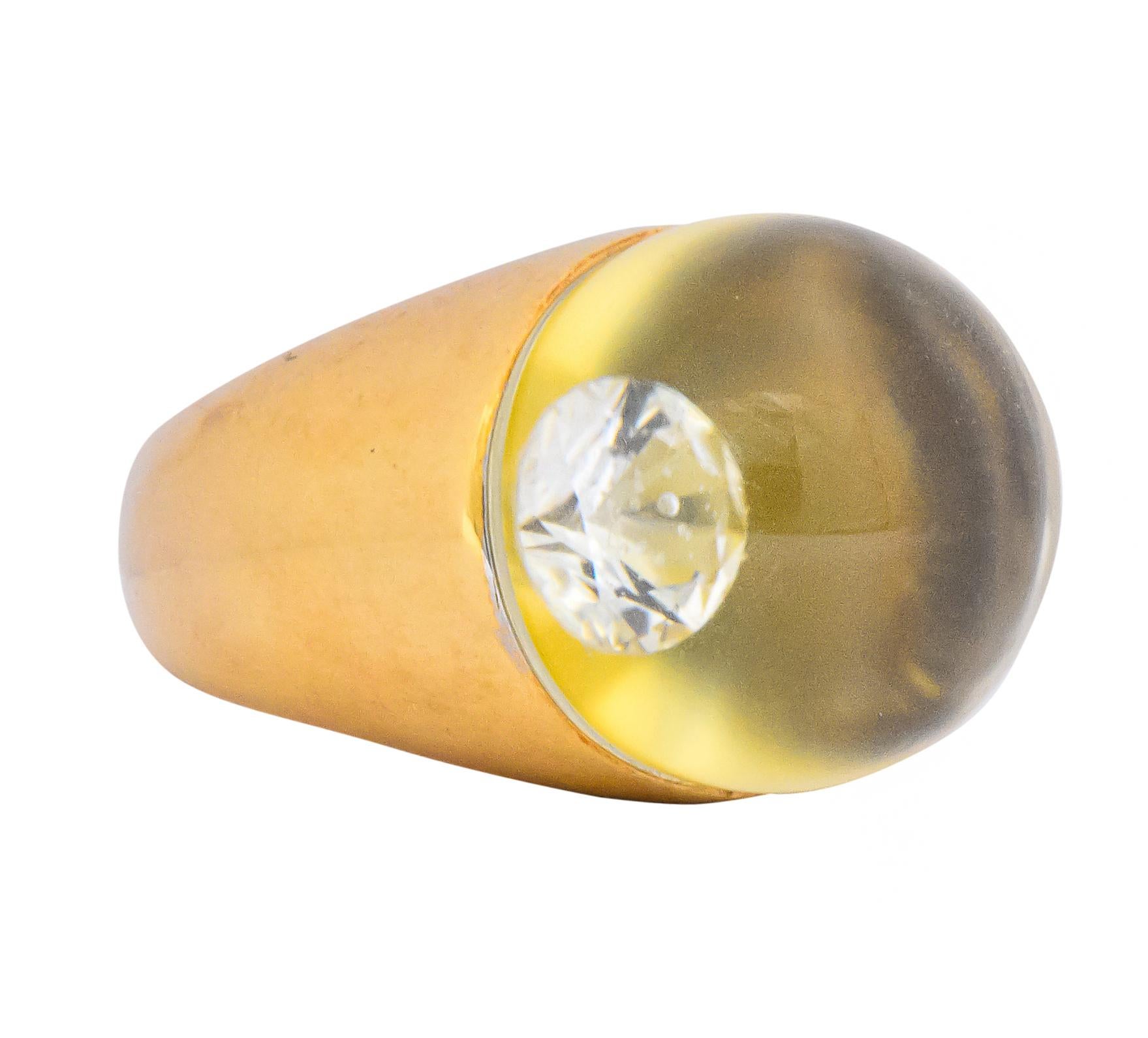 Featuring a rock crystal sphere measuring approximately 16.0 mm atop a round brilliant cut diamond

Nestled in a high polished gold formed setting

The crystal ball magnifies the diamond providing an illusion of a much bigger diamond

Fully singed