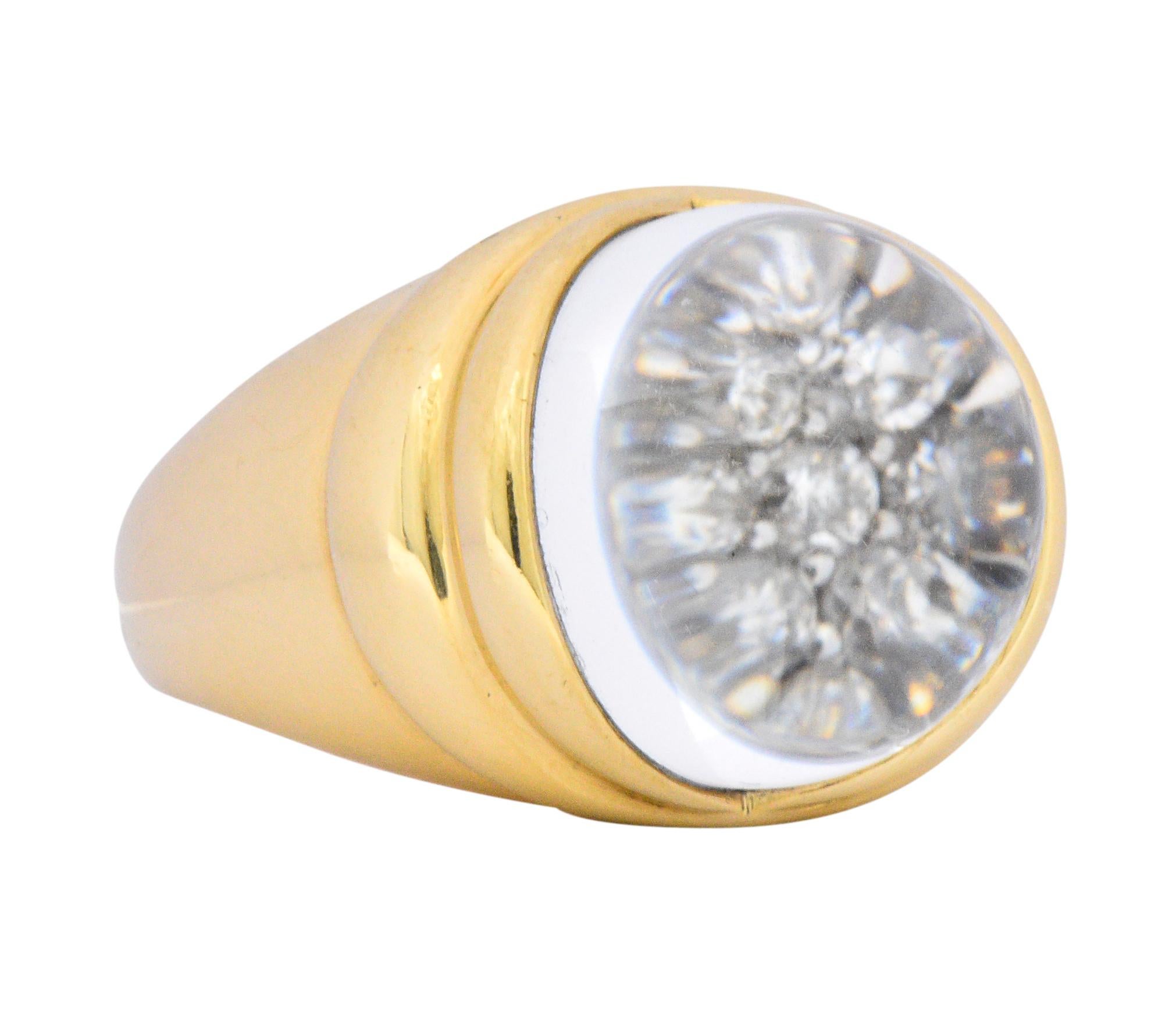 Featuring a rock crystal sphere measuring approximately 16.0 mm, over pavé set round brilliant cut diamonds

Set in a ribbed high polished gold mounting

The crystal ball magnifies the diamonds, creating the illusion of a larger diamonds

Fully