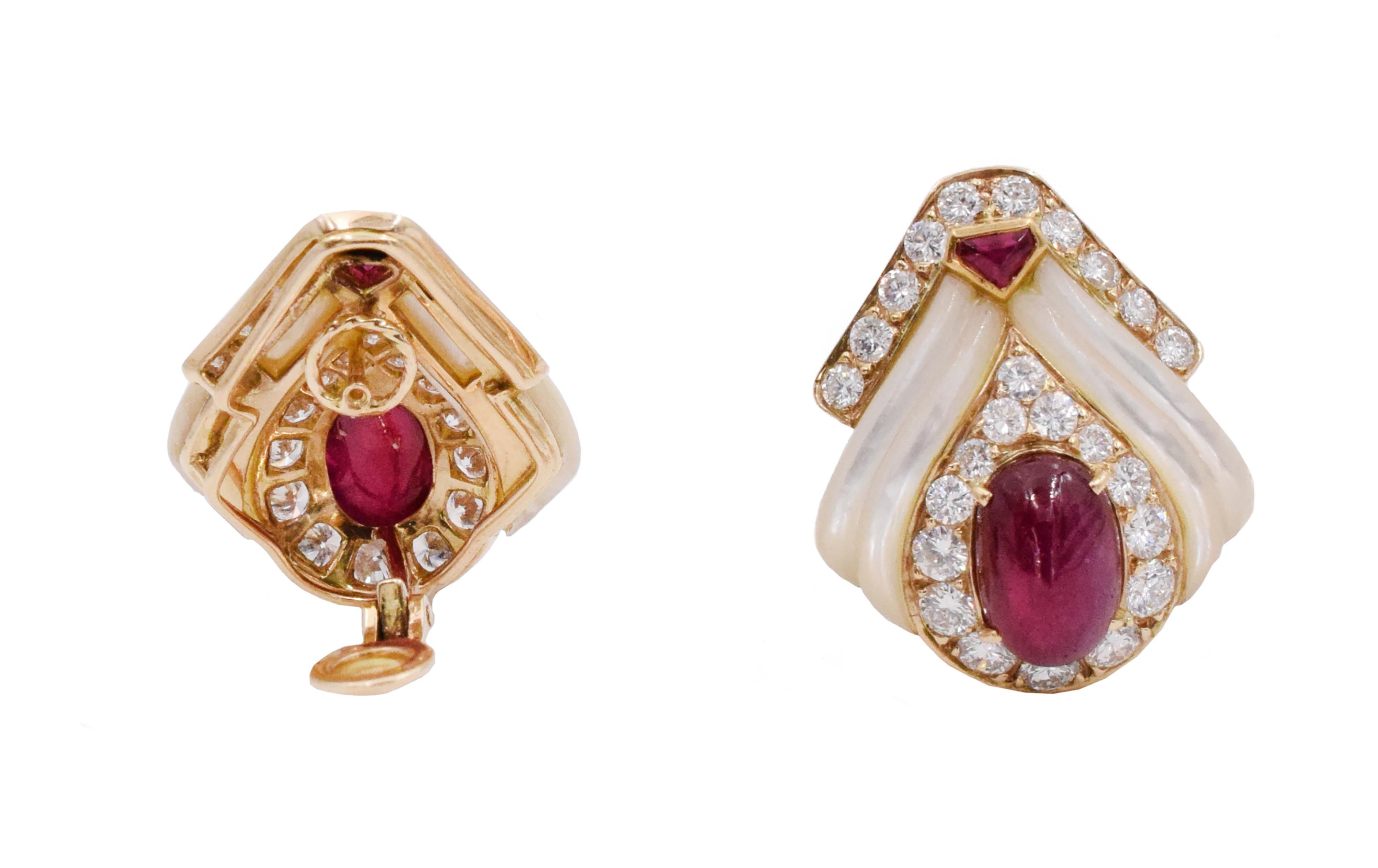 Mauboussin Paris ruby, mother of pearl and diamond ear clip earrings. .Consisting of two oval shape cabochon cut rubies in the center, and two smaller cabochon cut rubies on the top of the earrings. Accented by 50 round brilliant cut diamonds
