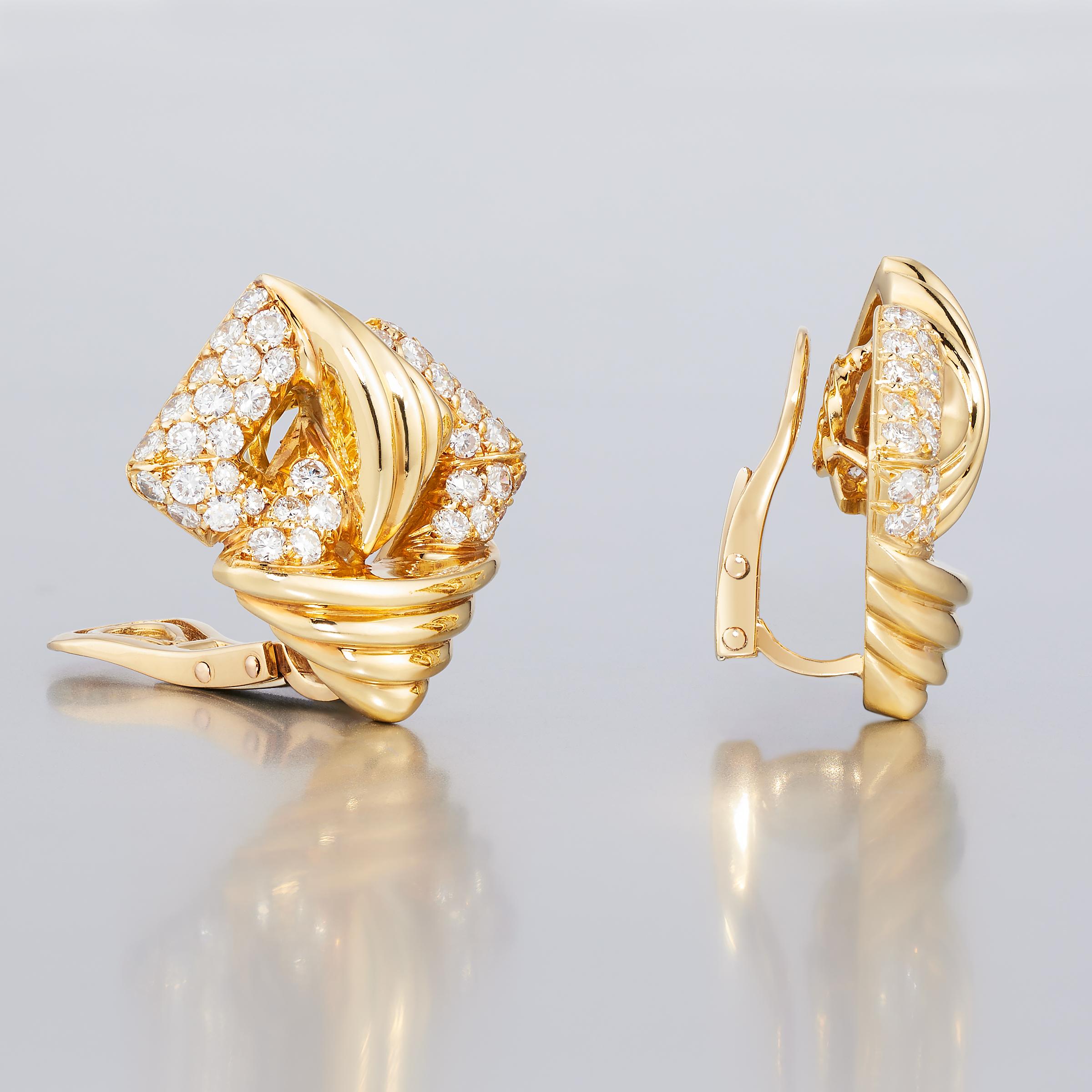An enchanting pair of vintage Mauboussin Paris diamond earrings from 1980s. They showcase approximately 2.5 carats of sparkling diamonds of high color and clarity (F to G / VVS to VS) set in shimmering 18 karat yellow gold. The earrings feature