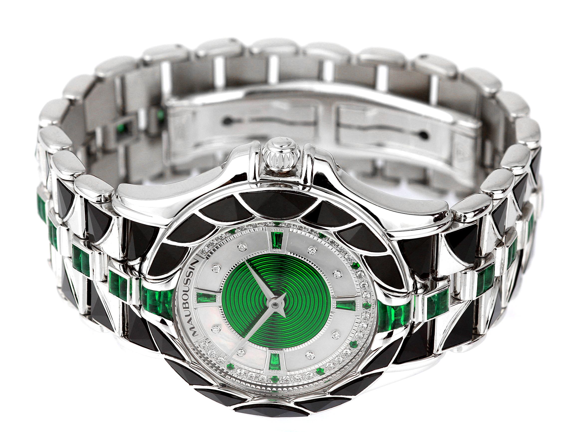 silver watch with emerald face