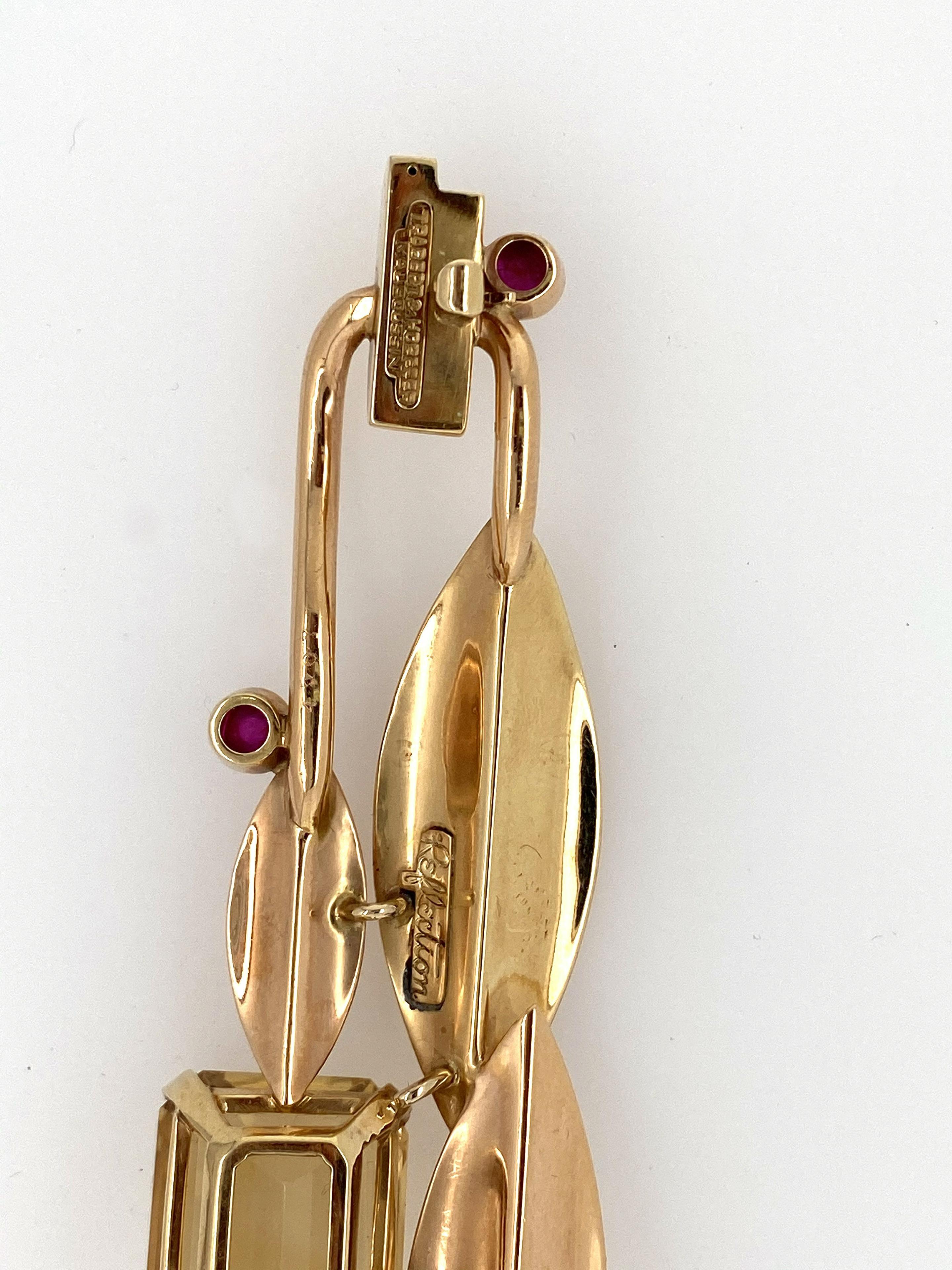 18K pink and yellow gold ruby citrine pin.  two cab rubies and one large citrine measures 15 x 20 mm. signed Reflction Trabert & Hoeffer Mauboussin, measures 5 1/2 x 1 1/8 inches, weight 14.5 dwt.