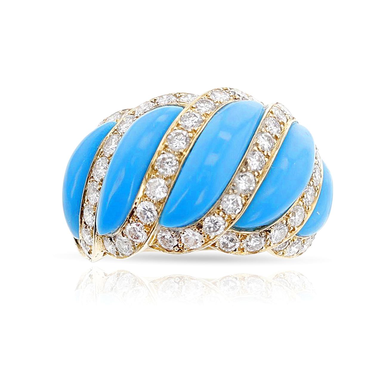 A unique Mauboussin Turquoise and Diamond Ring made in France in 18k Gold. The ring has turquoise cabochons outlined by round diamonds, weighing appx. 2.75 carats of F-G color and VVS/VS clarity. Ring size US 8. Stamped, French marks. The total
