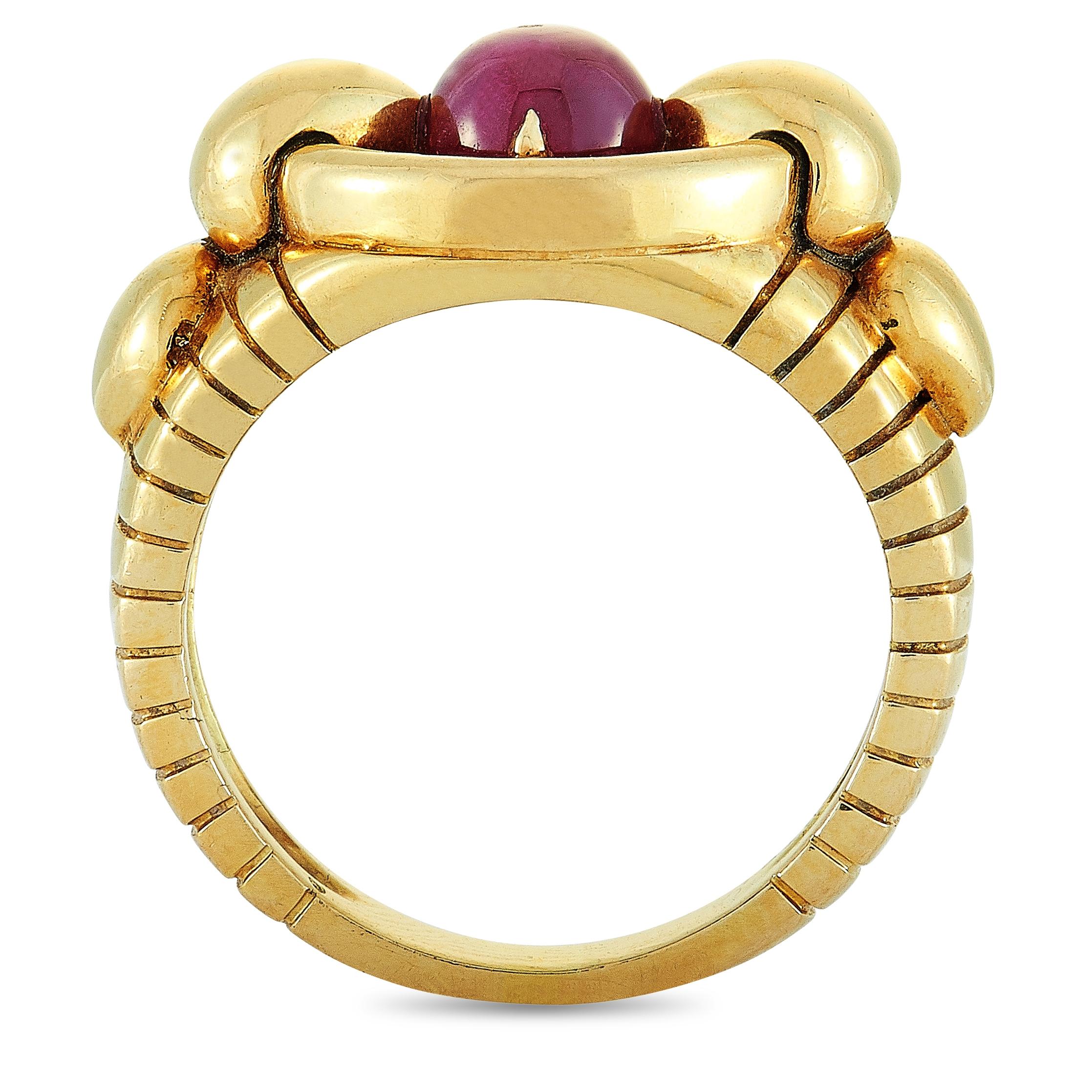 This vintage Mauboussin ring is made of 18K yellow gold and set with a 0.90 ct ruby and a total of 0.50 carats of diamonds. The ring weighs 10.3 grams, boasting band thickness of 3 mm and top height of 6 mm, while top dimensions measure 20 by 18