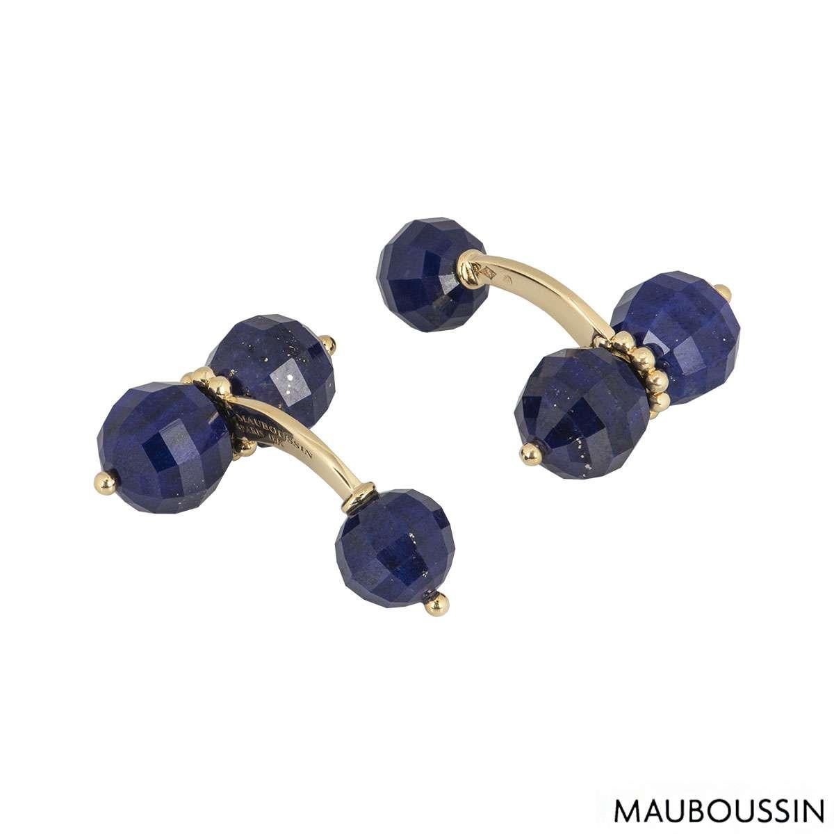 An 18k yellow gold pair of lapis lazuli cufflinks by Mauboussin. Each cufflink is set with 3 faceted lapis balls set with a part beaded stem and a single bead on the sides. The cufflinks have a length of 1.2 inch and width of 0.9 inch with a gross