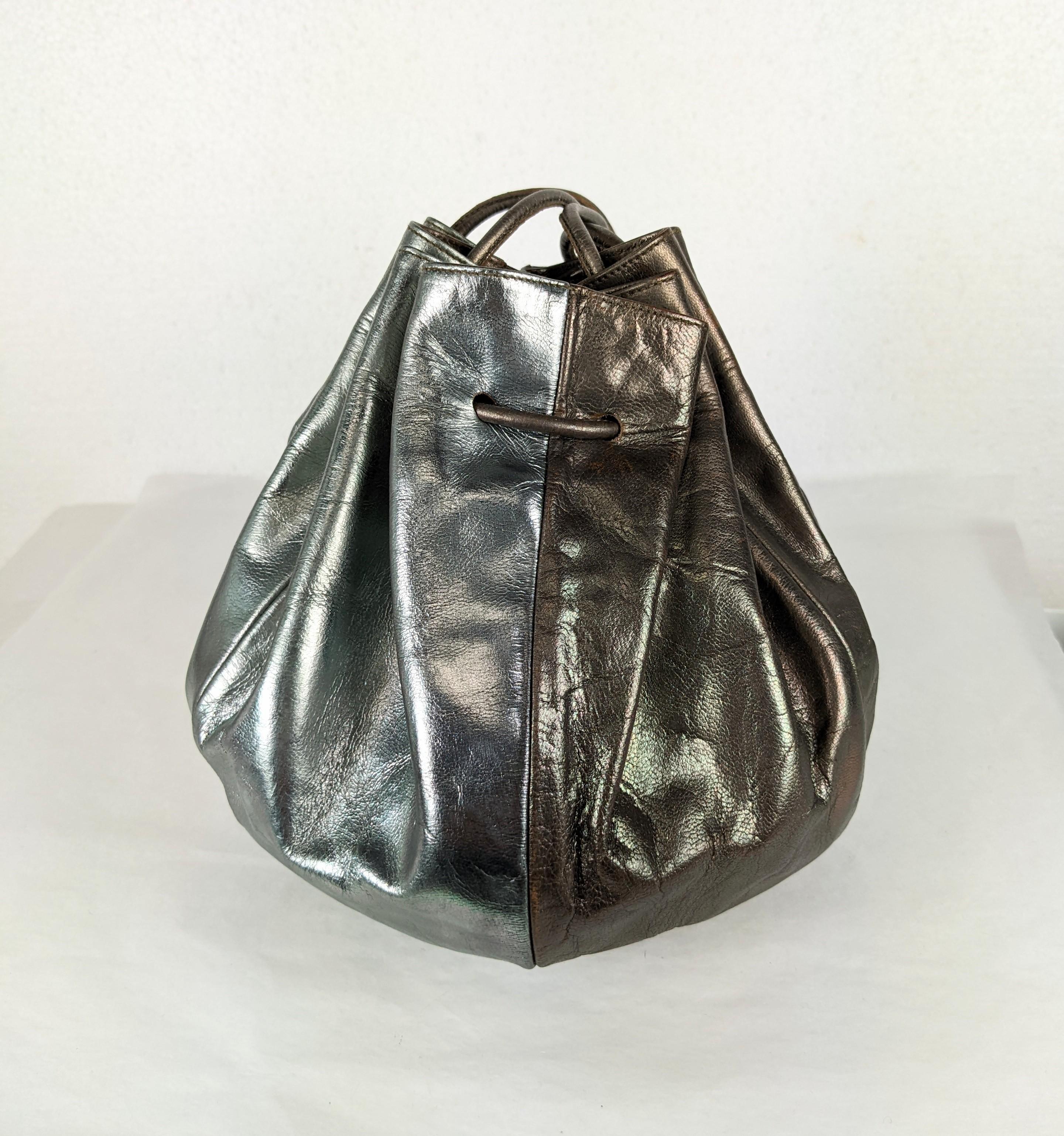 Cool, easy Maud Frizon Bi Color Leather Metallic Drawstring Bag from the 1980's France. Icy blue silver and bronze metallic leather are spliced in this drawstring shoulder style. 
6