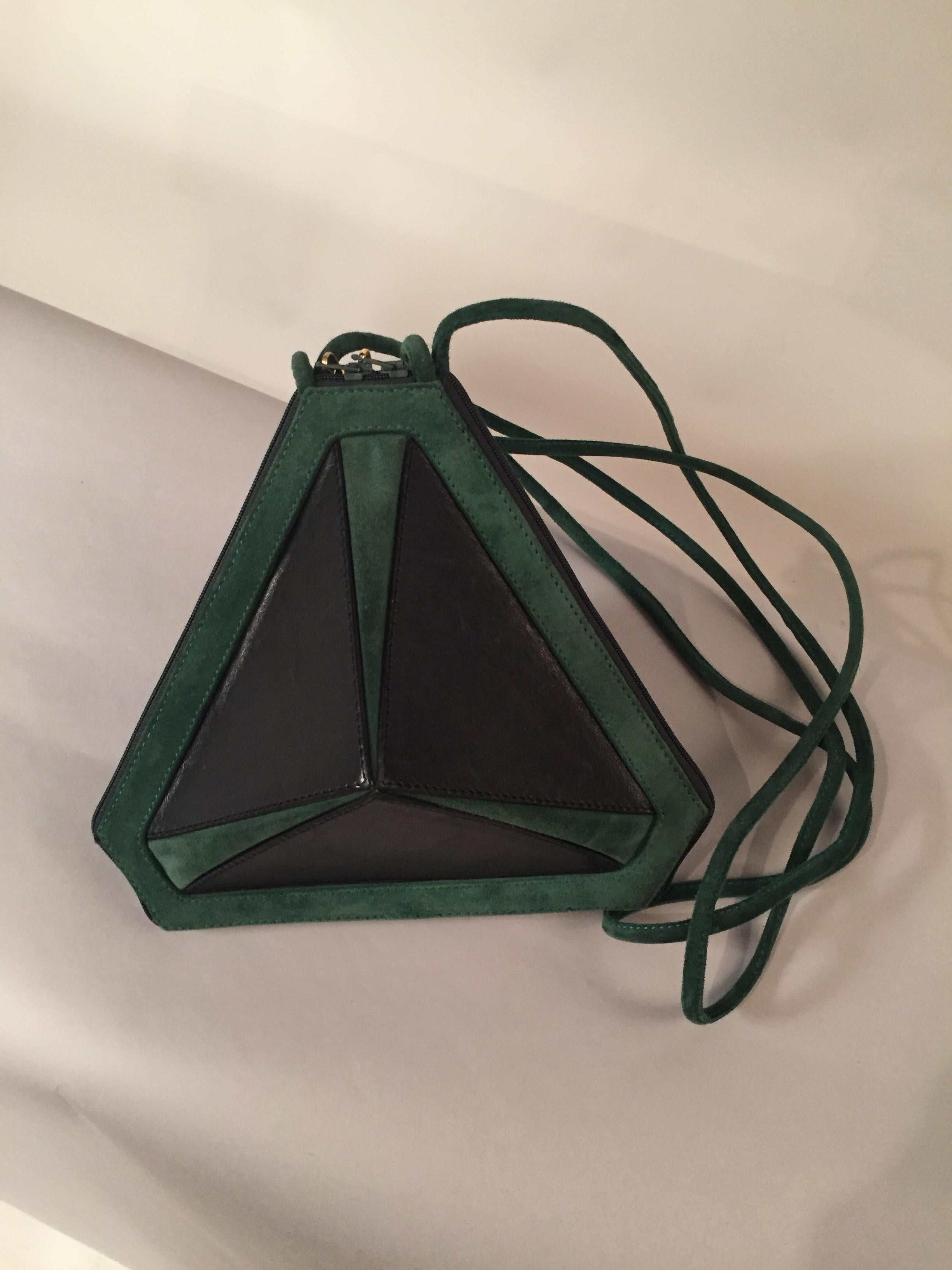 This bag Maud Frizon has the most unusual shape that I have ever seen, all angles and corners, with two zippers at the center with golden high heel zipper pulls. It is a real conversation piece!  The bag is made from black lambskin and forest green