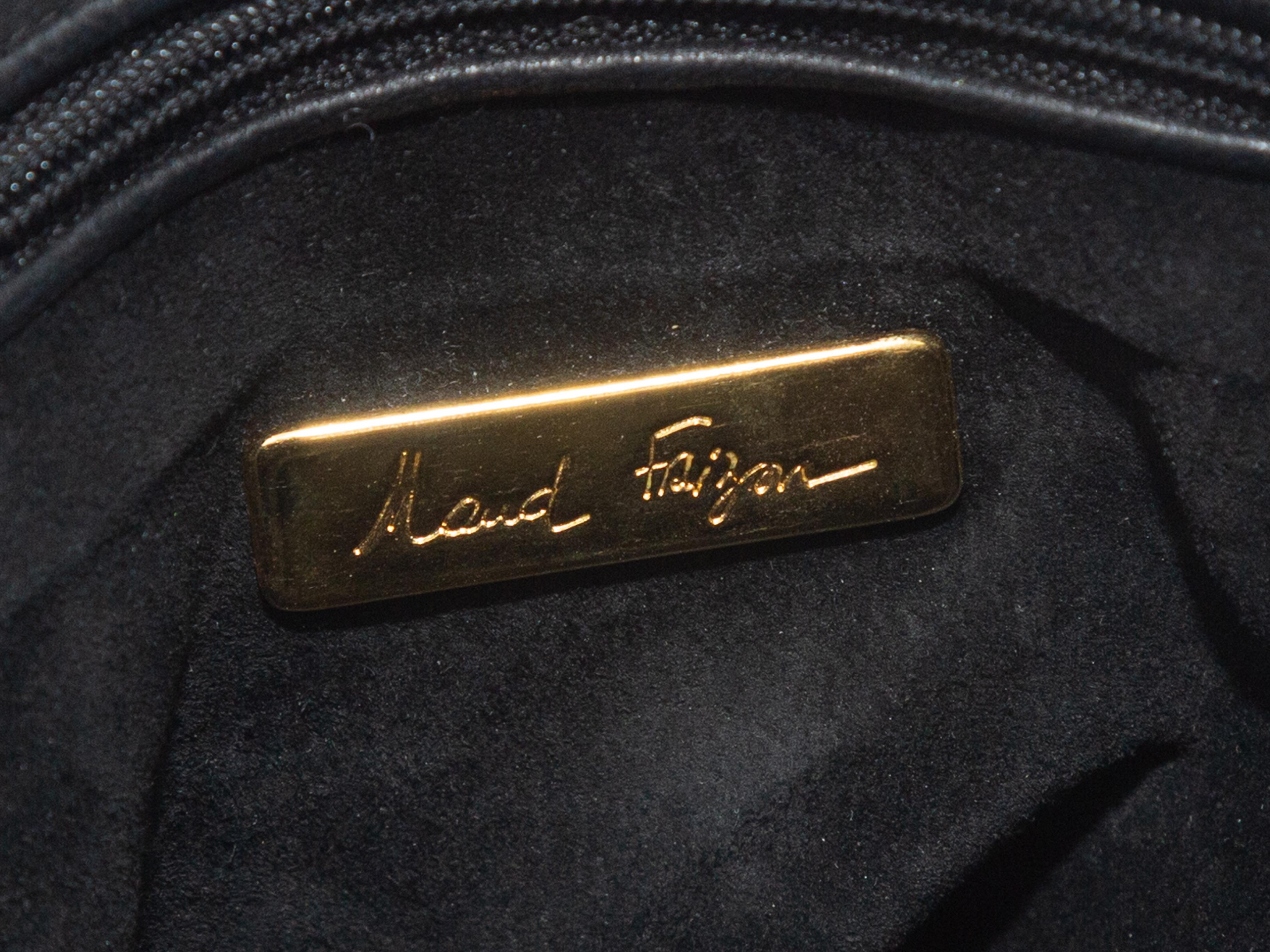 Product details: Vintage black leather handbag by Maud Frizon. Dual straps featuring stud accents. 17