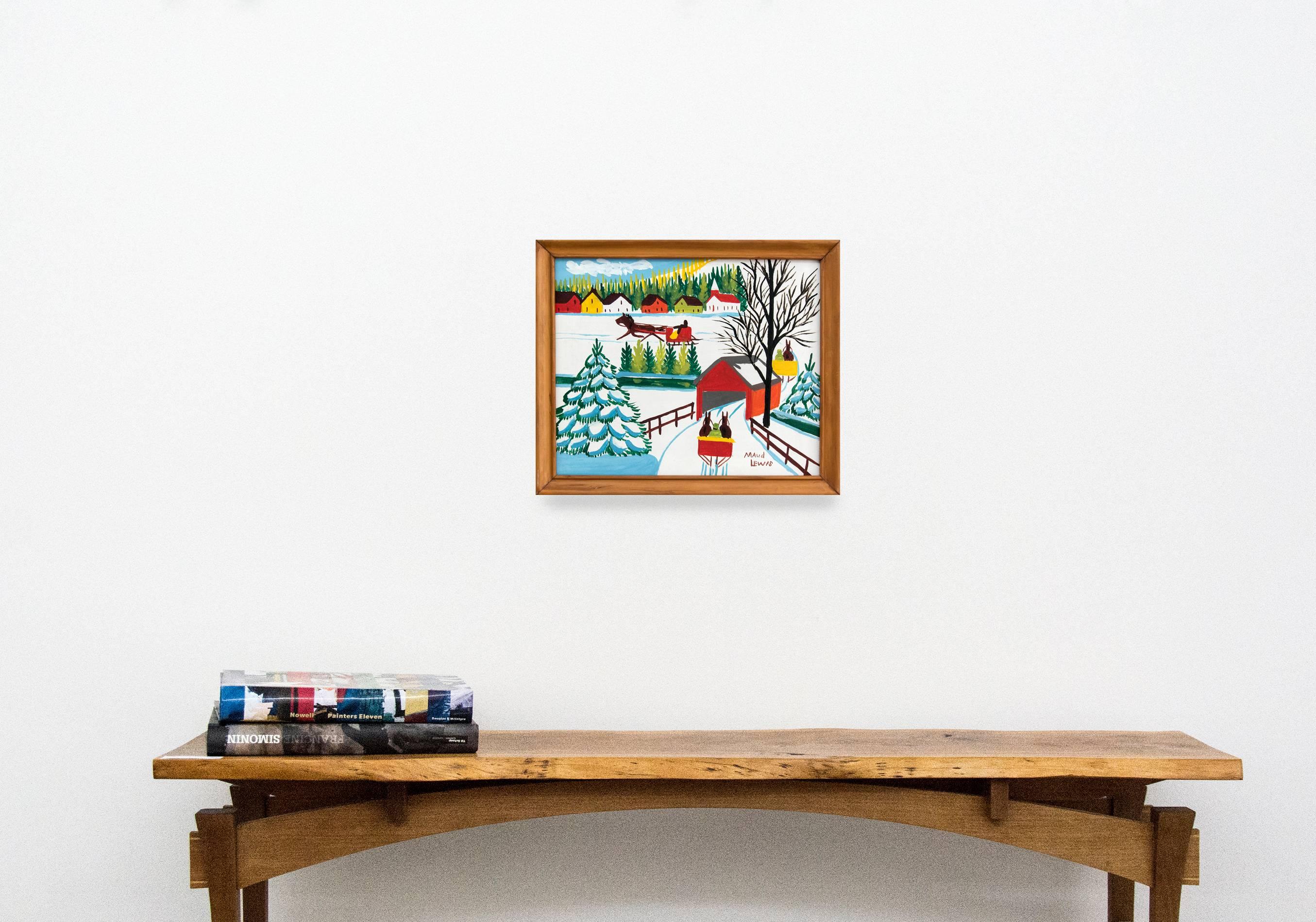 Three horse drawn sleighs pass through a covered bridge along a wintry road in this delightful village scene by folk artist Maud Lewis. This painting is signed and framed without glass. 

Maud Lewis’s paintings are filled with joy and depict her