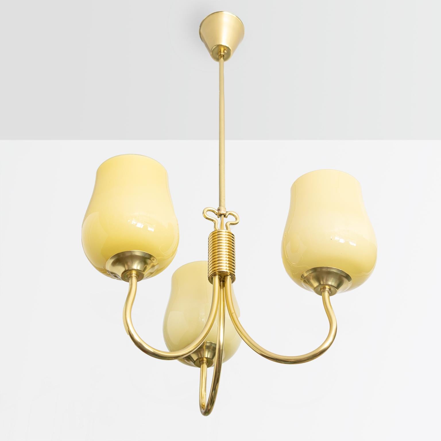 A polished brass Scandinavian Modern 3-arm pendant designed by Mauri Almari for Idman, Finland, late 1940s. The lamp has been newly polished and newly rewired with 3 standard sockets for use in the USA. Shades are original.

Measures: Height 35“,