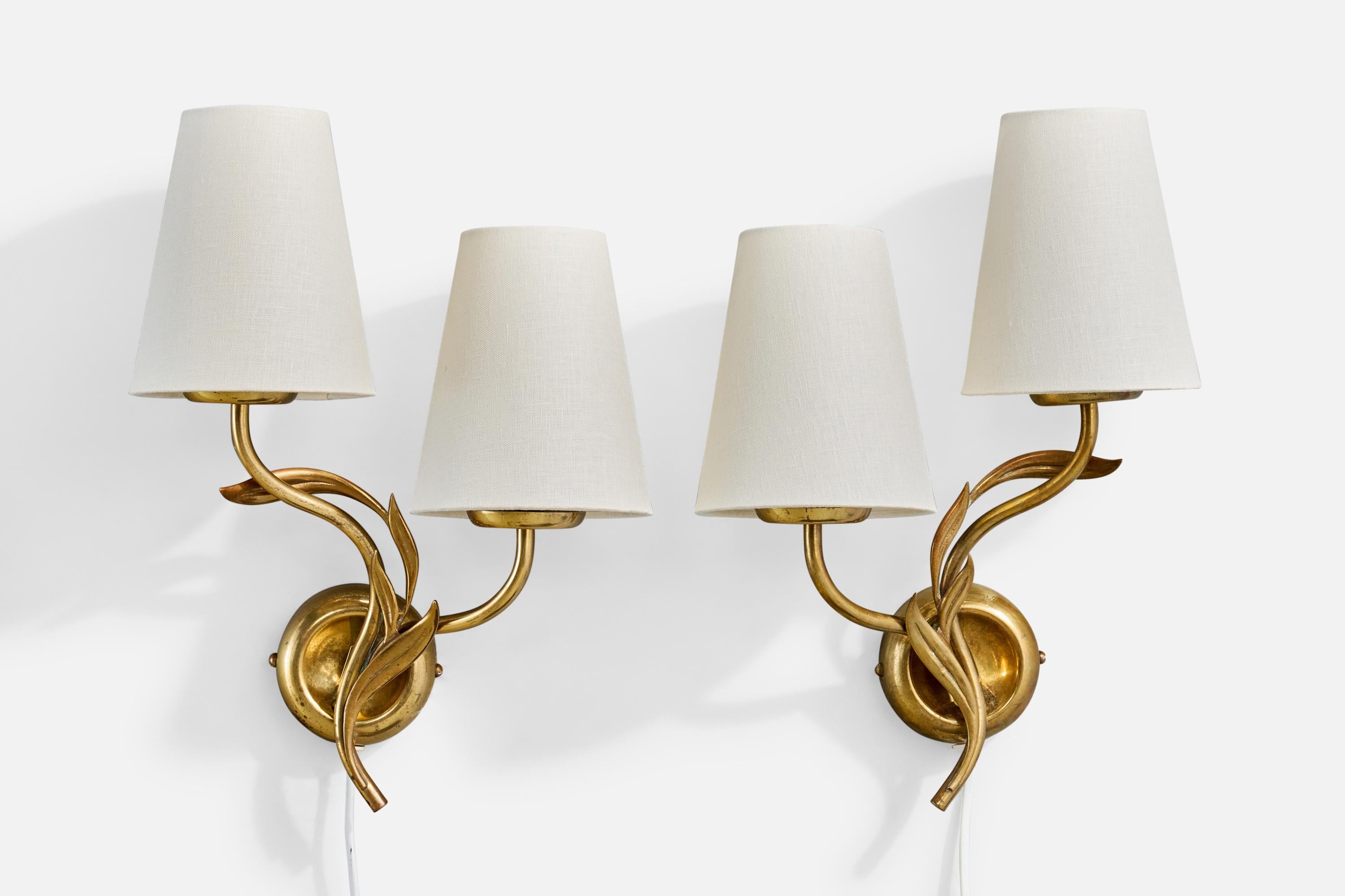 A pair of brass and white fabric wall lights designed by Mauri Almari and produced by Idman, Finland, c. 1950s.

Overall Dimensions (Inches): 15.125