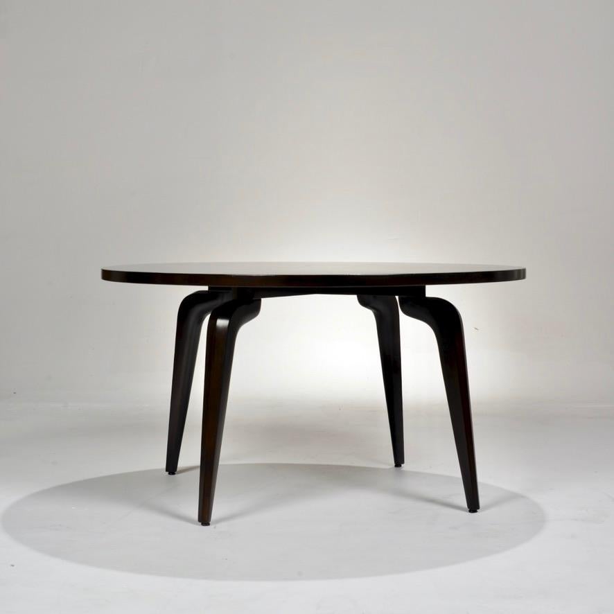 A sleek, round dining or card table in ebonized walnut designed by Maurice Bailey for Monteverdi-Young.

All items are available to view at our DTLA Arts District Warehouse:
Motley LA
1909 E 7th St.
Los Angeles, CA 90021.