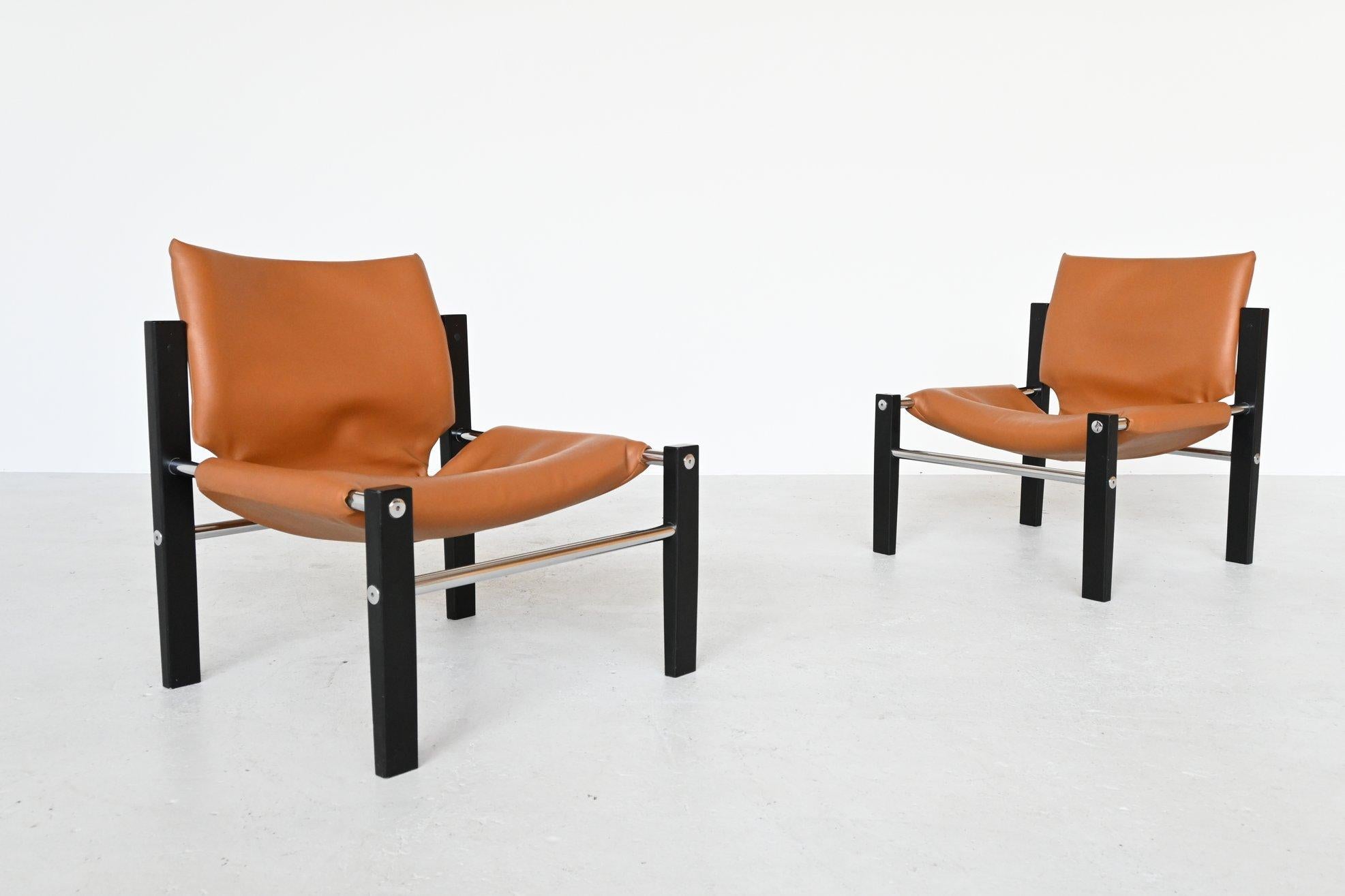 Stunning safari Chelsea lounge chairs designed by Maurice Burke for Arkana, Bath England 1970s. These chairs fall right in line with the designs of Arne Norell for Sirocco and Kaare Klint. These lounge chairs are upholstered in a camel leather and