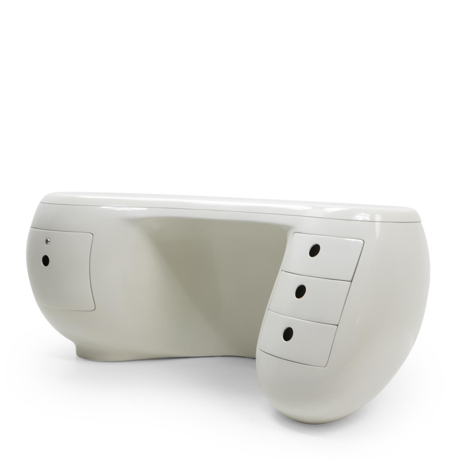 Designed by Maurice Calka (1921-1999) and produced by Leleu Deshay in only a very limited quantity, this Boomerang shaped desk represents a new technical application of fiberglass in French furniture production started in the late 1960s.

The desk