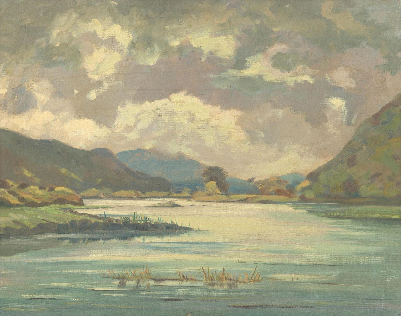 A fine landscape study depicting a tranquil lake with distant mountains. Faintly inscribed in graphite to the reverse 'Maurice C. Wilks'. On canvas on stretchers.
