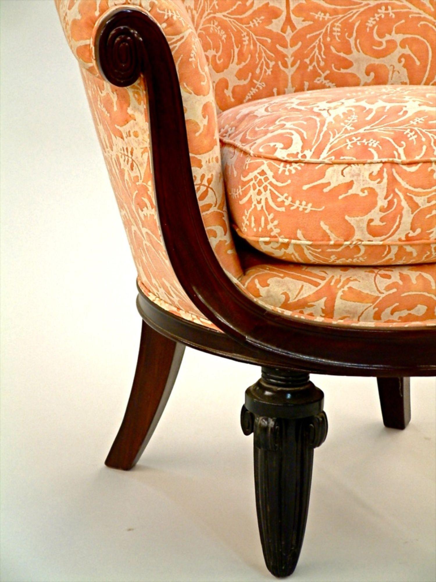 Classic French Art Deco single arm/club chair by Maurice Dufrêne in sculpted wood with sculpted ebony legs. This small-scale boudoir chair was designed by Dufrêne for La Maitrise, the design studio of the famous Galleries Lafayette store in Paris,