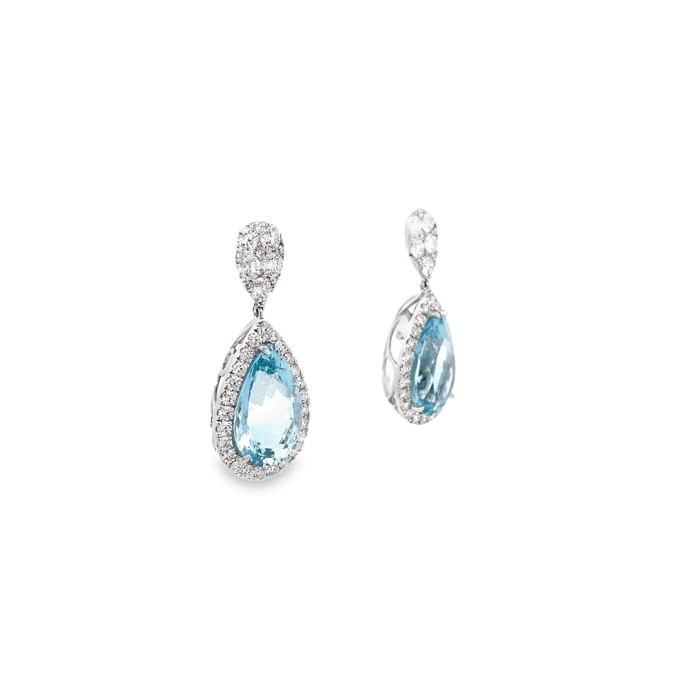 These exquisite 18k white gold earrings exude a sense of timeless elegance with their classic and traditional design. The focal point of each earring is a stunning pear-shaped aquamarine gemstone, totaling an impressive 16.48 carats, which glows