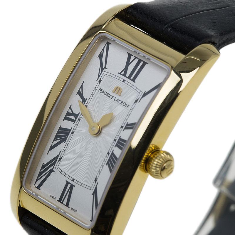 This sophisticated Fiaba watch comes from the house of Maurice Lacroix. The rectangular case hols a gold-palted bezel. The cream dial features black Roman numerals, gold-tone hands, and the logo. The ribbed crown complements the overall look. It