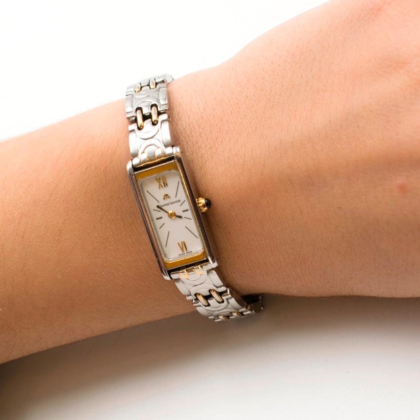 Maurice Lacroix Silver & Gold-tone Stainless Steel Watch

- Dainty, slim bracelet watch
- Stainless steel
- Silver-tone with gold-tone accent details
- Rectangular face
- Sapphire crystal
- Water resistant
- Comes with 2 extra links

Please note,