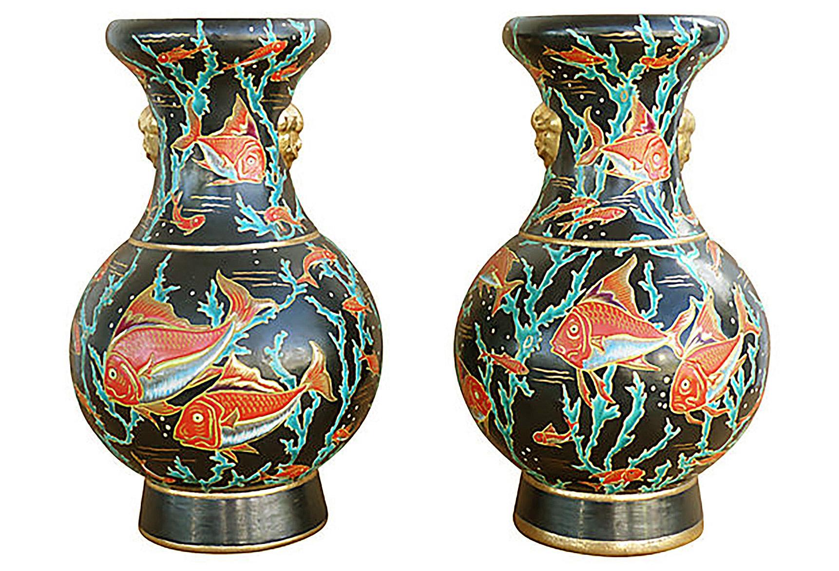 Maurice P. Chevallier Longwy French Ceramic Neptune Vases, 1950s

Offered for sale is a fine pair of Longwy vases in the Neptune pattern, circa 1954. The vases are designed by the prominent French ceramicist Maurice Paul Chevalier. This very rare