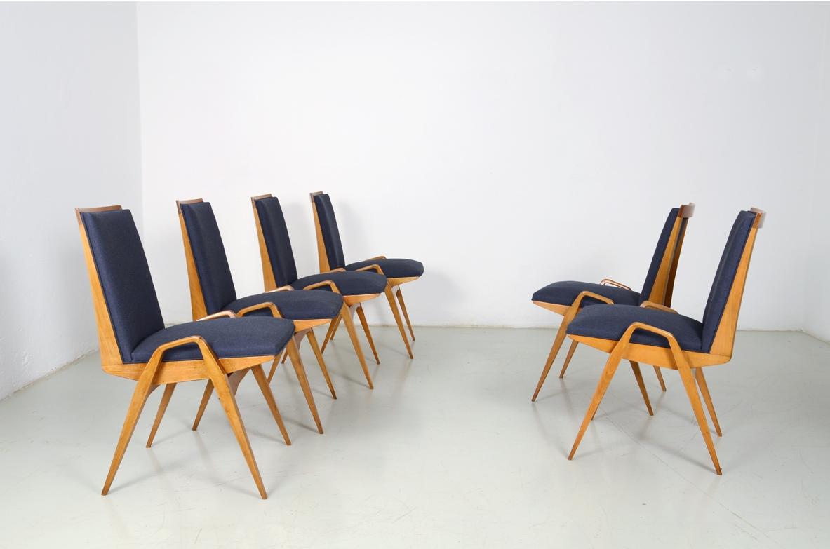 Maurice Prè
Set of eight chairs in light wood and fabric upholstery.
France, 1950s.
