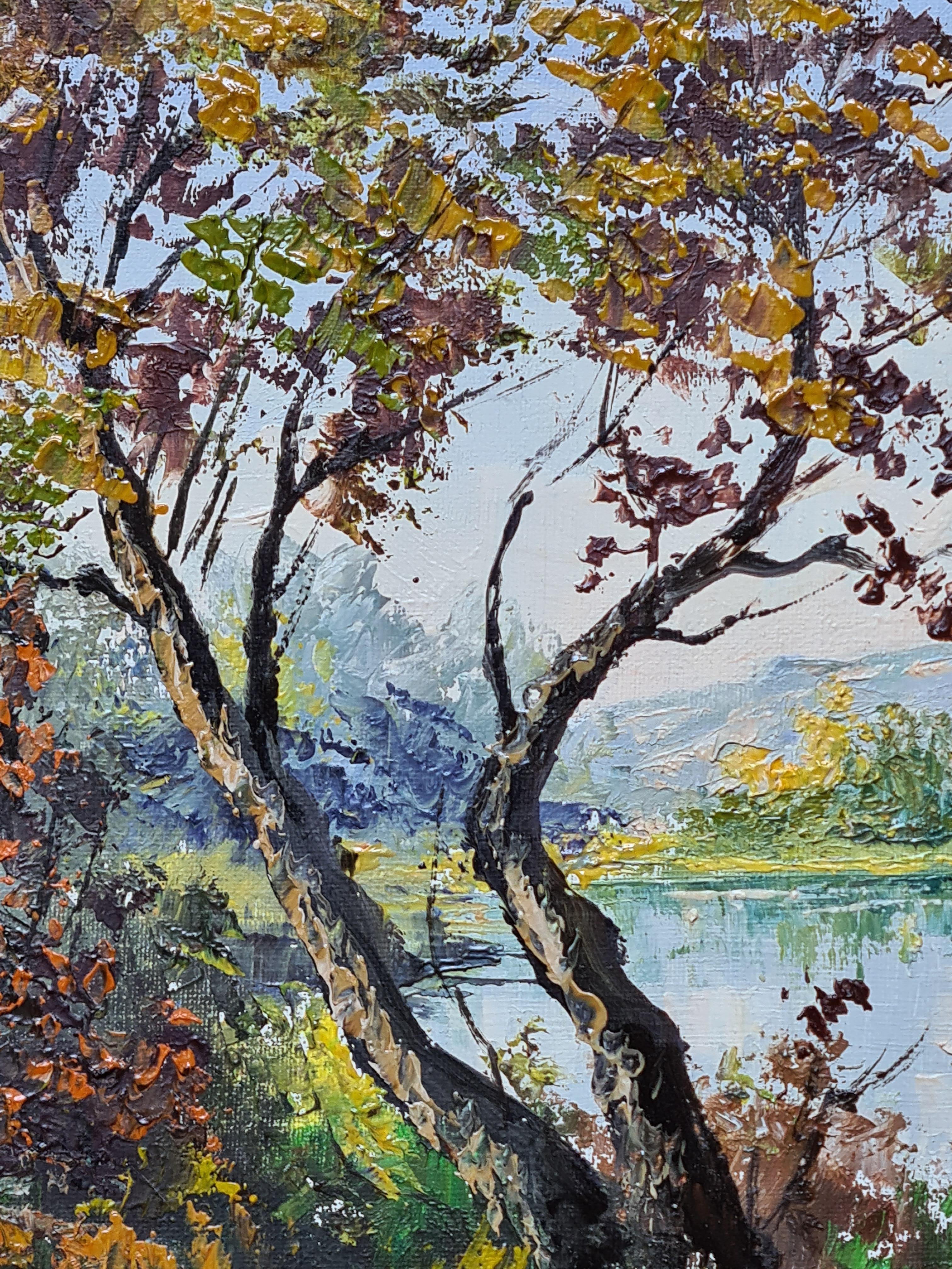 Huile sur toile représentant des arbres, un paysage et des montagnes au-delà d'un lac par Maurice Schwab, également connu sous le nom de 