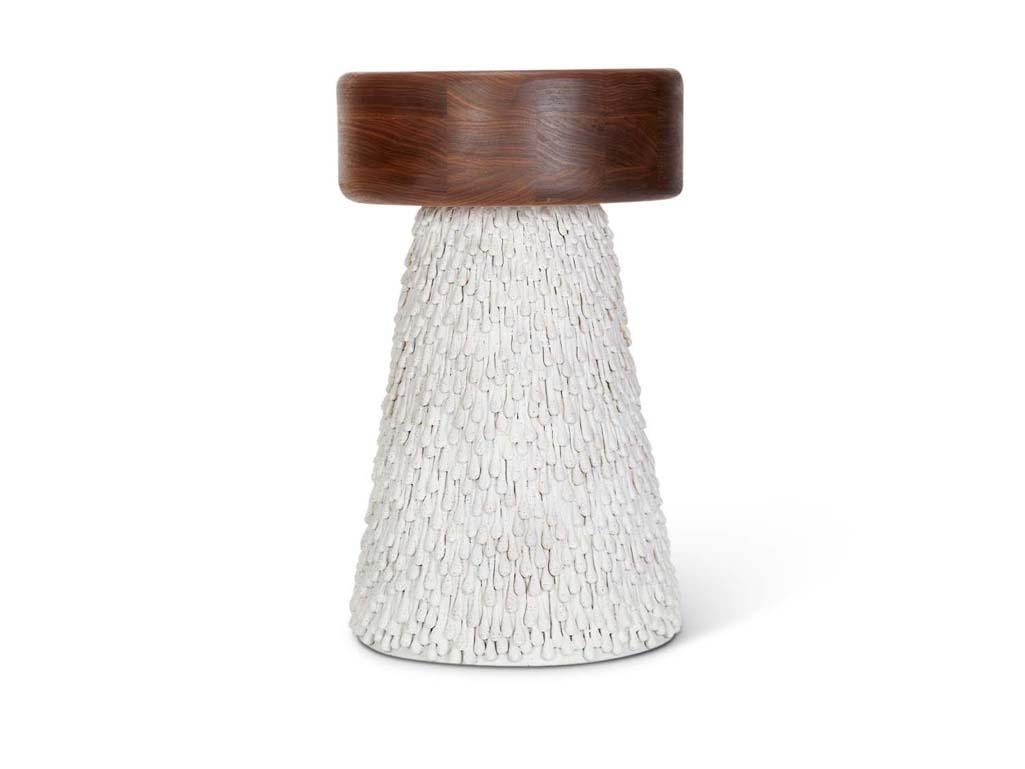 The Maurice Side Table features a walnut top and handmade ceramic base by artist Natan Moss.