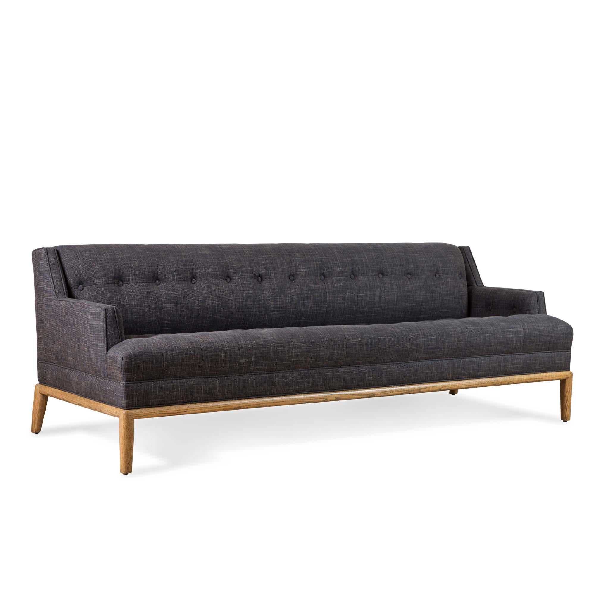 The Maurice sofa is a midcentury inspired sofa with a tufted seat, back, and inner arms and piped details. The sofa rests atop a simple, rounded American walnut or white oak base. 

The Lawson-Fenning collection is designed and handmade in Los