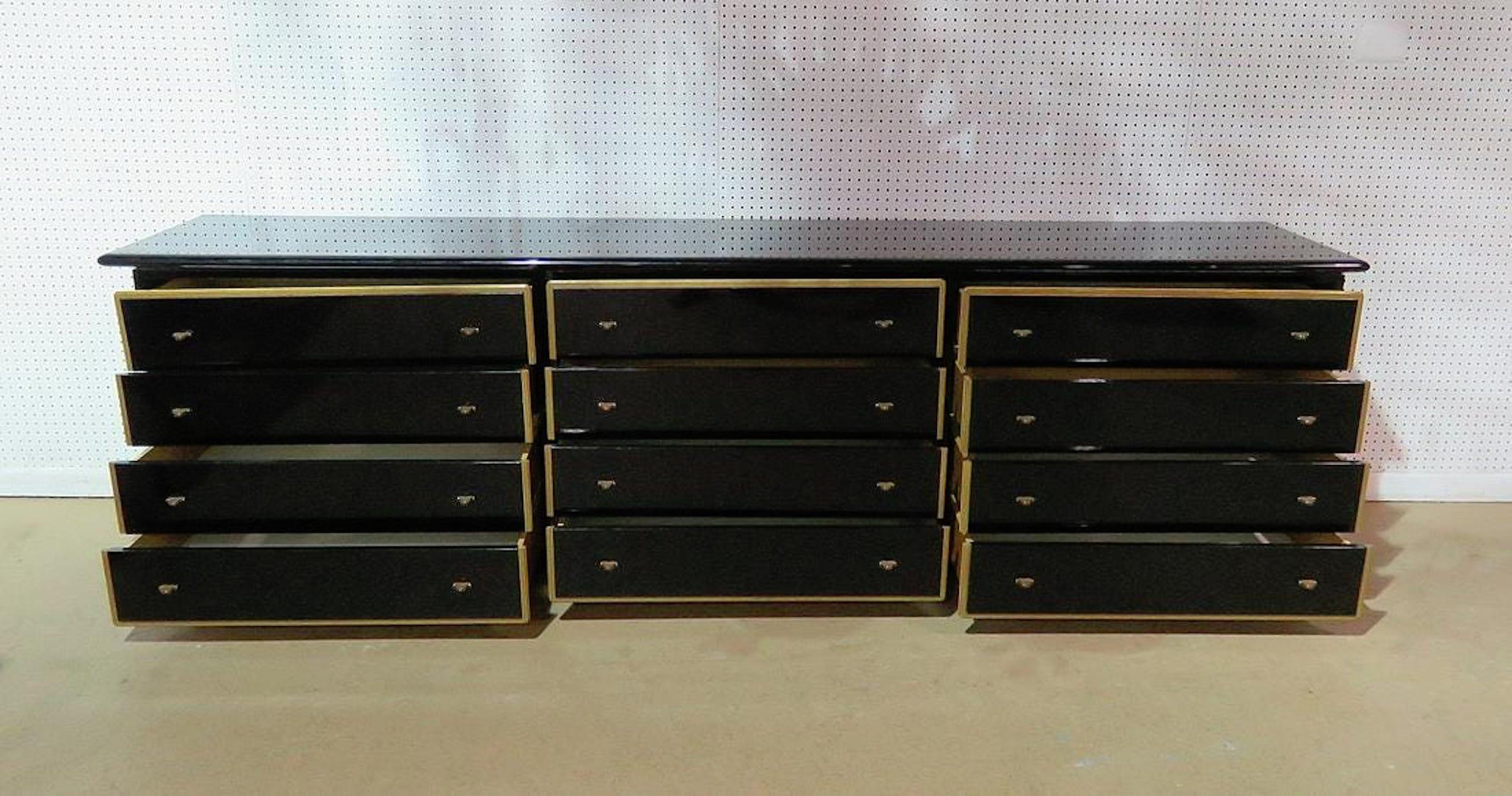 Large twelve drawer black dresser with blonde wood trim.
(Please confirm item location - NY or NJ - with dealer).
   