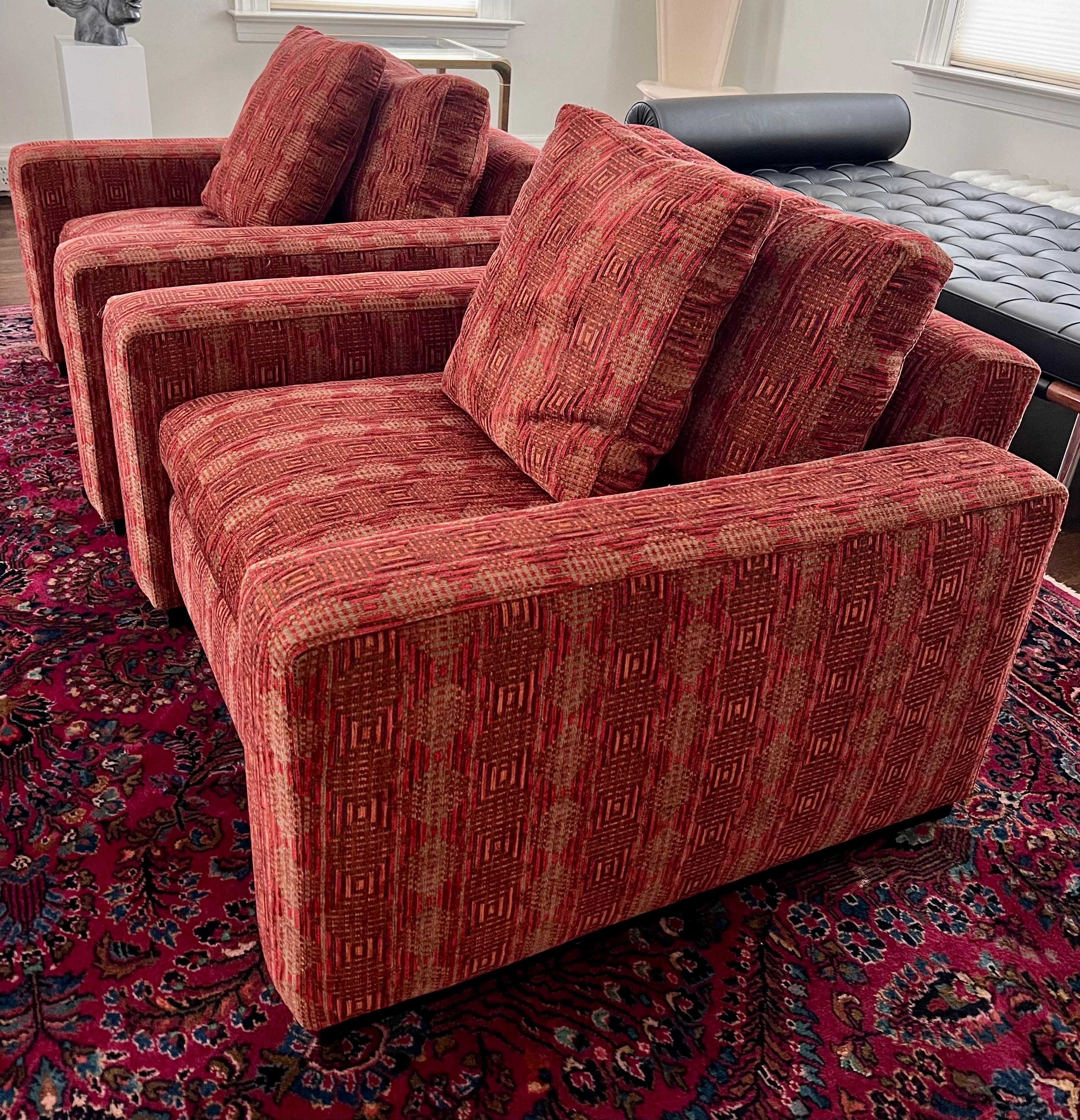 Simply sophisticated Maurice Villency club chairs have a roomy and comfortable seat and have a modern and a deep silhouette designed for lounging in style. They sit in a wood plinth base.
Upholstered in a luxurious chenille print in rust.