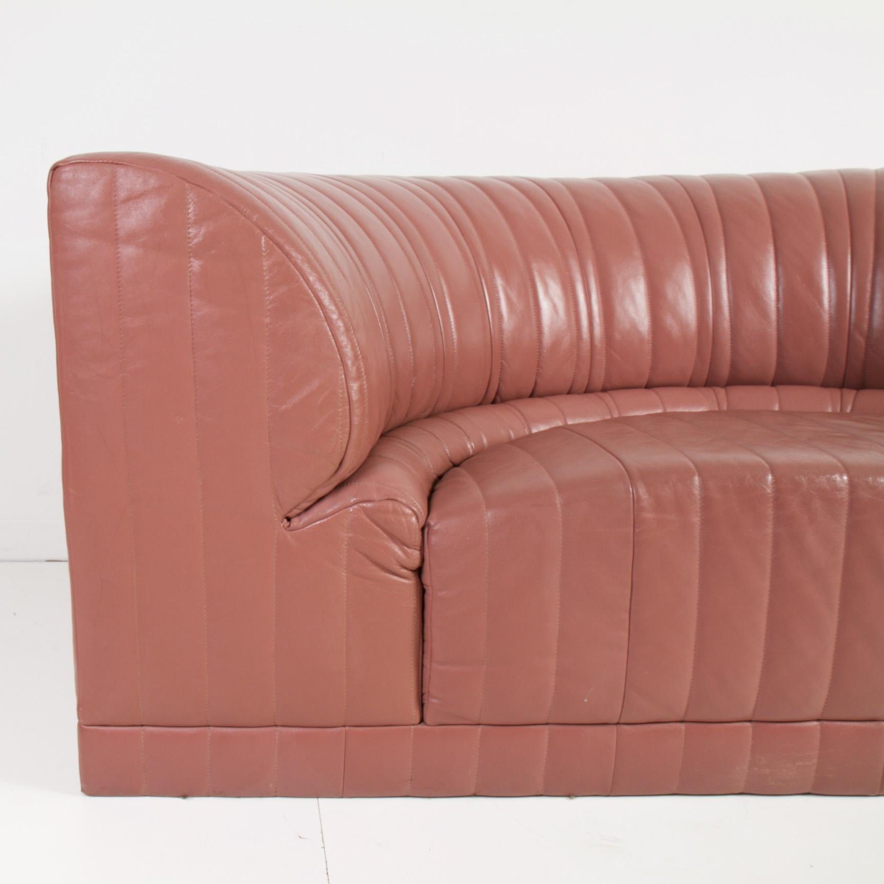 Modern concave shaped leather couch in very clean condition. Leather is as soft and subtle as it was the day it was delivered.

 