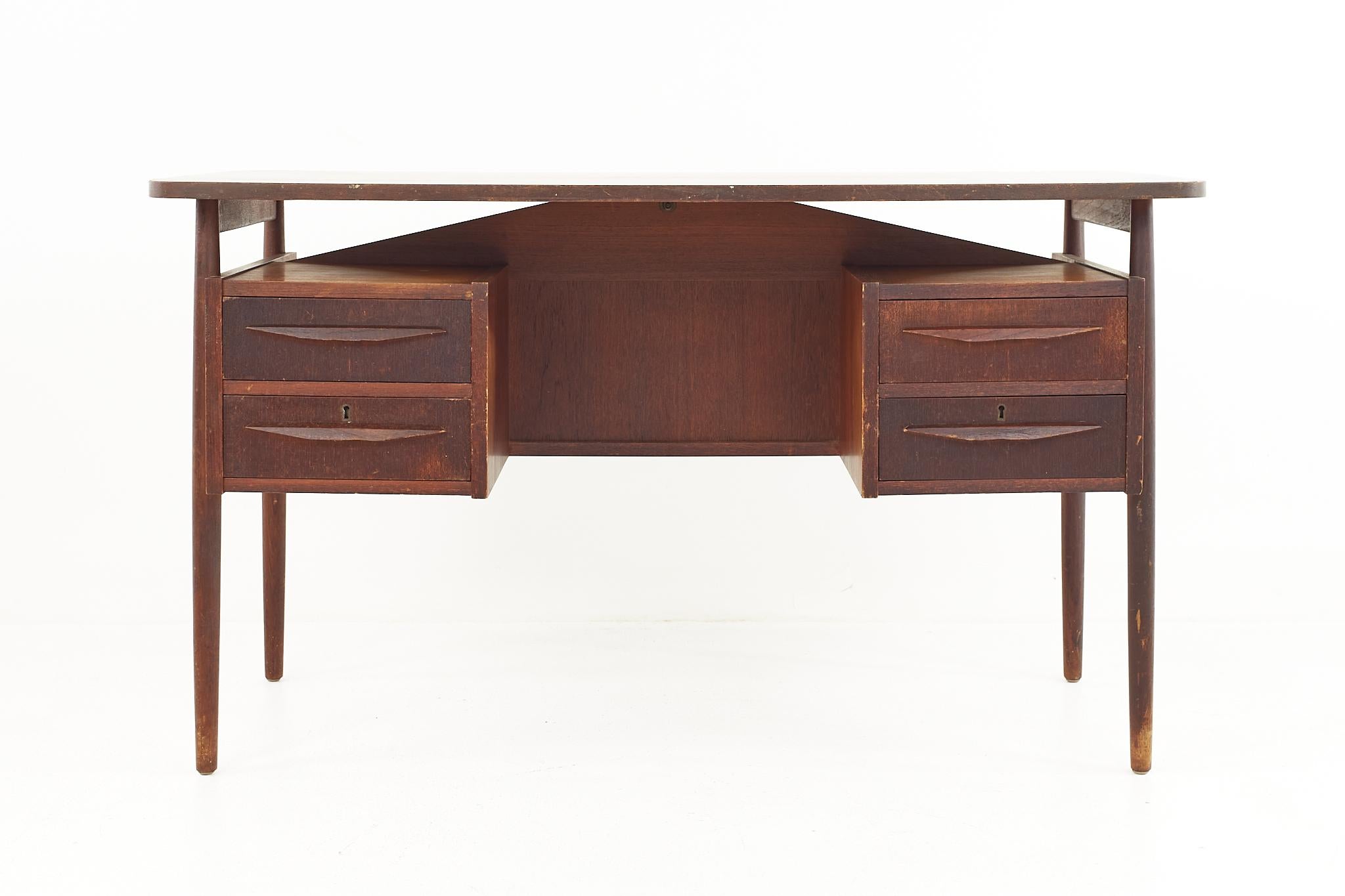 Maurice Villency mid-century floating teak executive desk

The desk measures: 51 wide x 26.5 deep x 29 high, with a chair clearance of 27.75 inches 

All pieces of furniture can be had in what we call restored vintage condition. That means the