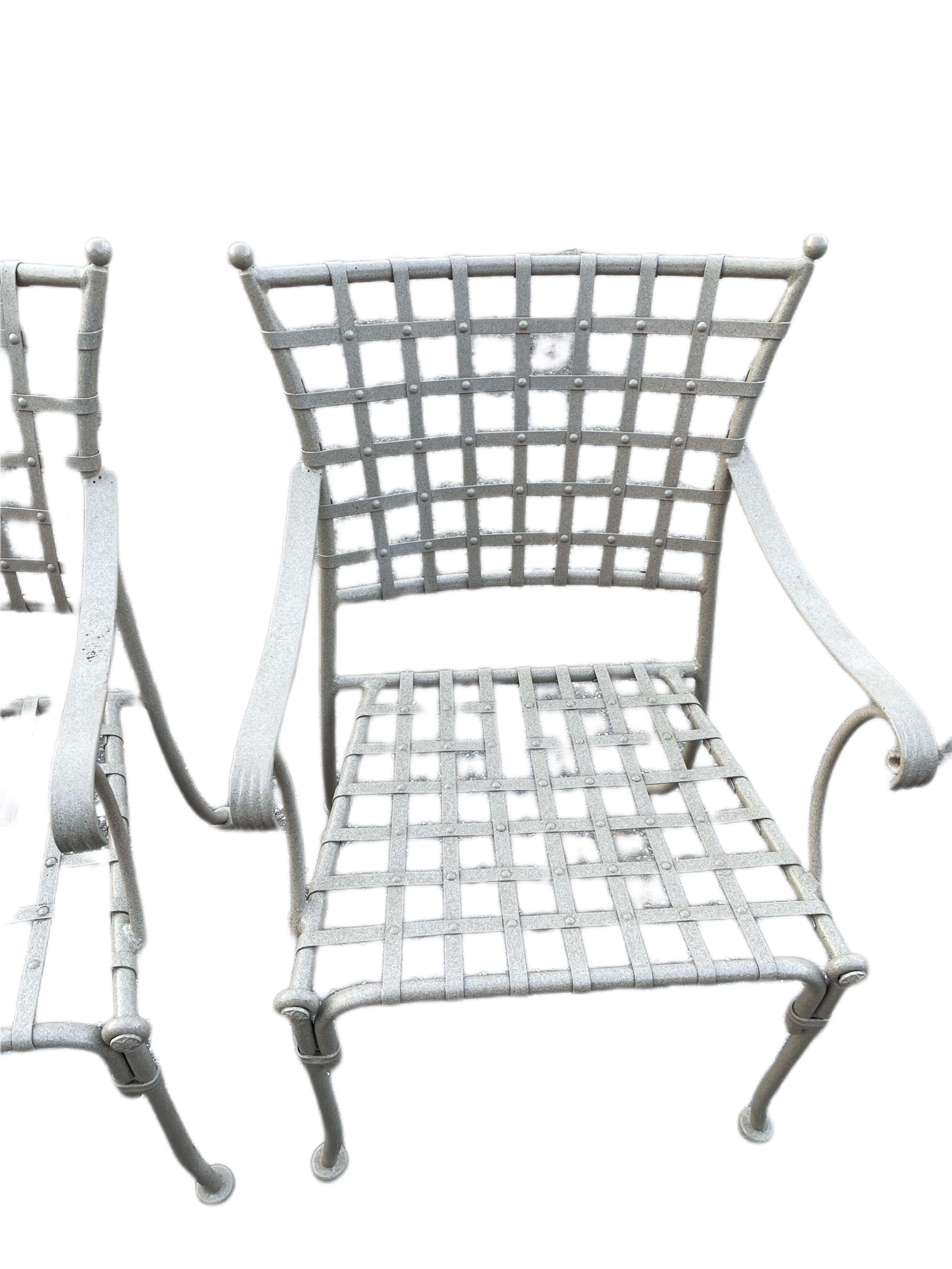 Mario Papperzini style for Salterini Hammered nail head dining armchairs

With a Beige Powder-Coated finish, these iron chairs are perfect to withstand all types of weather. Featured hammered studded nail heads along latic back, curved arms and leg,