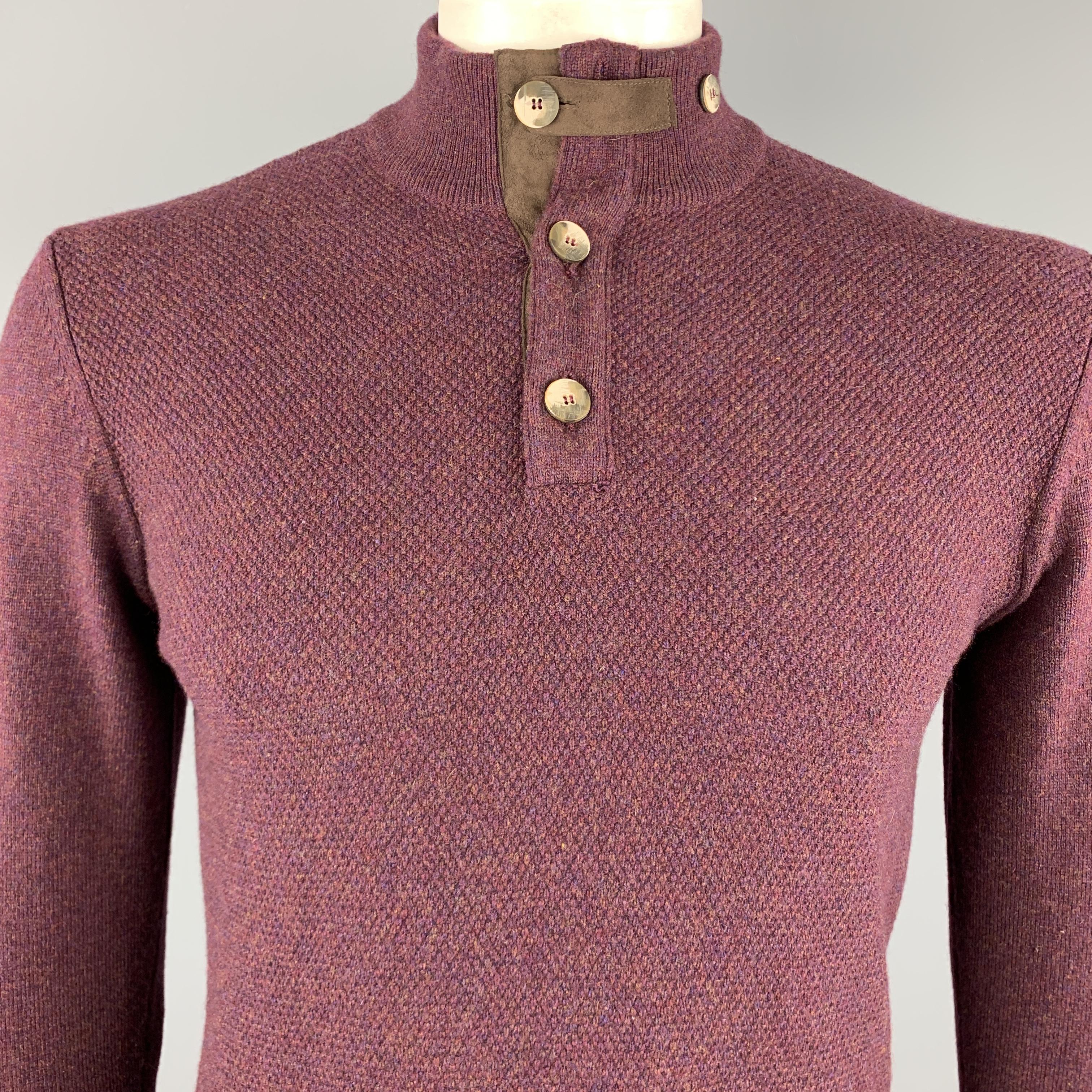 MAURIZIO BALDASSARI pullover comes in a burgundy cashmere featuring a suede trim and a buttoned collar. Made in Italy.

Excellent Pre-Owned Condition.
Marked: M

Measurements:

Shoulder: 18 in. 
Chest: 40 in. 
Sleeve: 25 in. 
Length: 25 in. 

