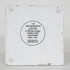 L.O.V.E. Sculpture by Maurizio Cattelan, middle finger in Concrete material