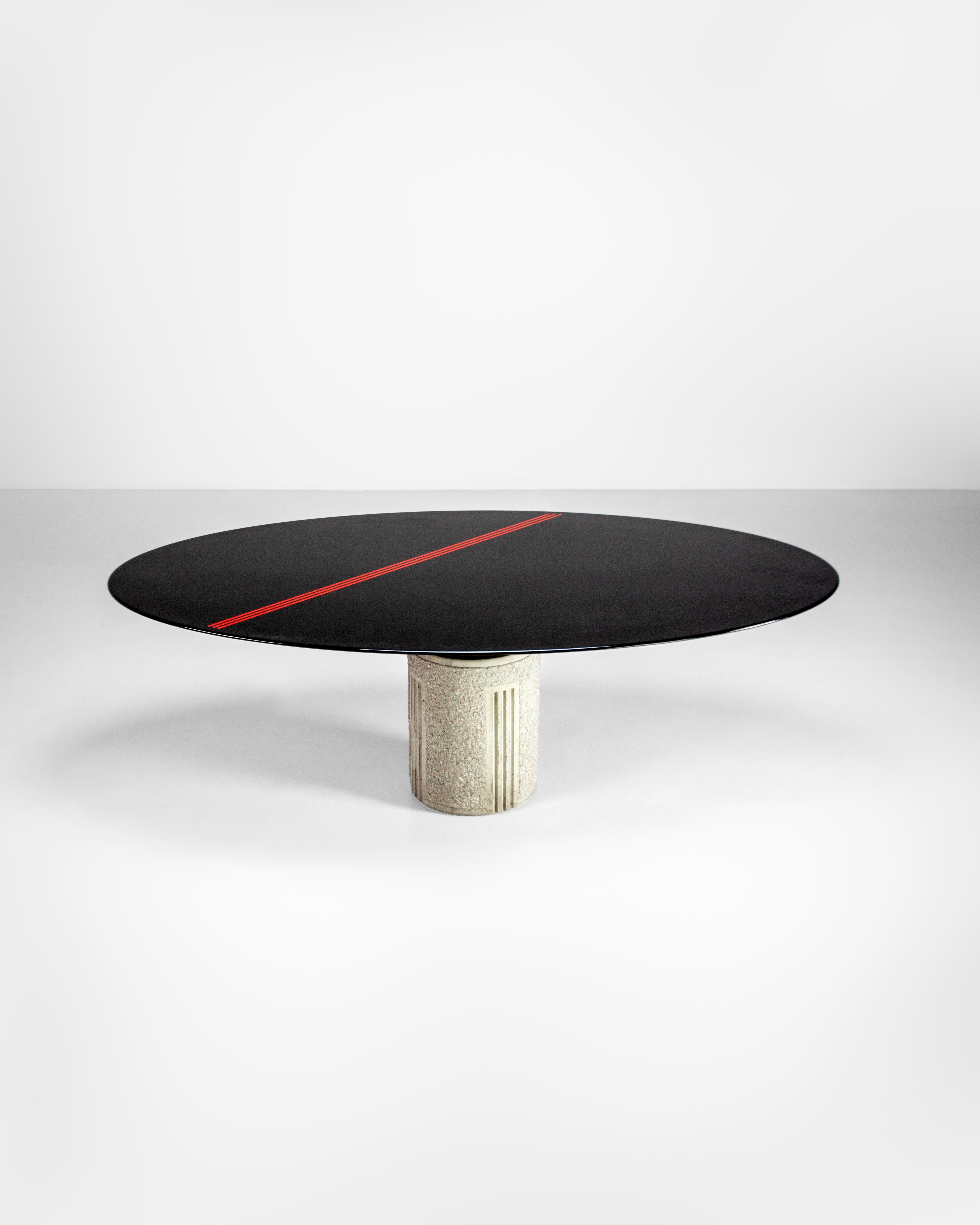 Saporiti is one of the most innovative Italian design companies and among those that have experimented the most with materials, forms and innovations in the broadest sense. This dining table has an imposing cylindrical base of carved and engraved