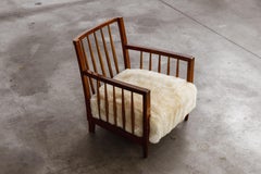 Sillones Maurizio Tempestini, madera de cerezo y piel de oveja, Italia, años 30