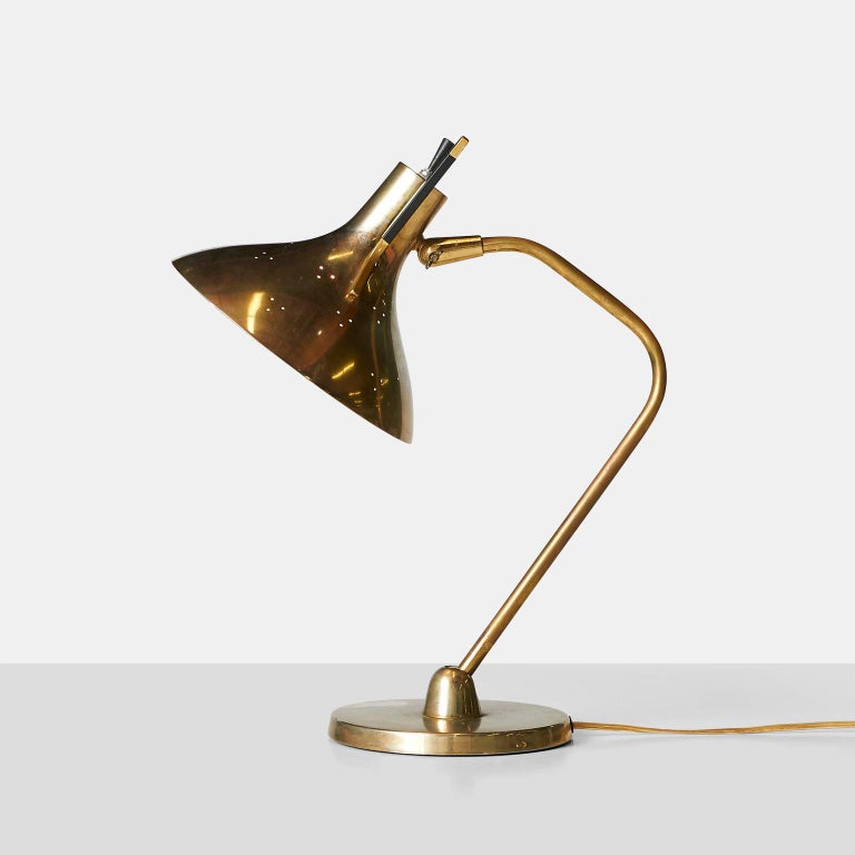 A desk lamp for Lightolier that has been rewired for use in the United States. Often attributed to Maurizio Tempestini.