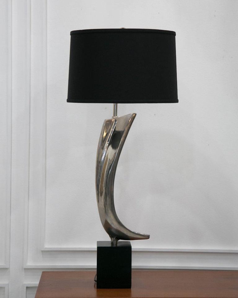 A beautiful, sculptural table lamp designed by the Laurel Lamp Co., Featuring a nickel plated body, black base and a new custom black lamp shade (included in purchase).

Dimensions:

Total height 39