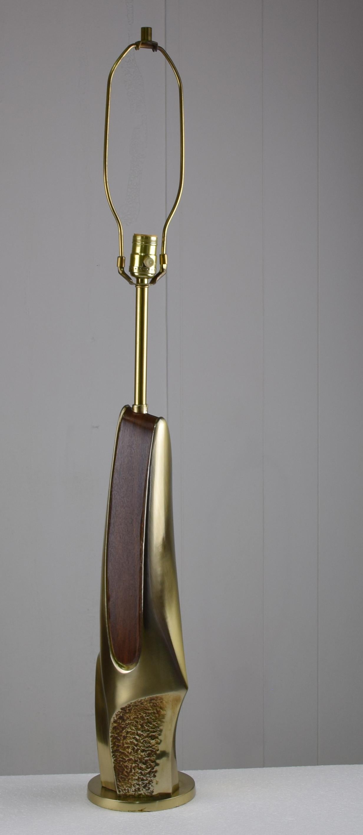 Sculptural abstract cast brass table lamp with original shade. rosewood to brass. Measures 39
