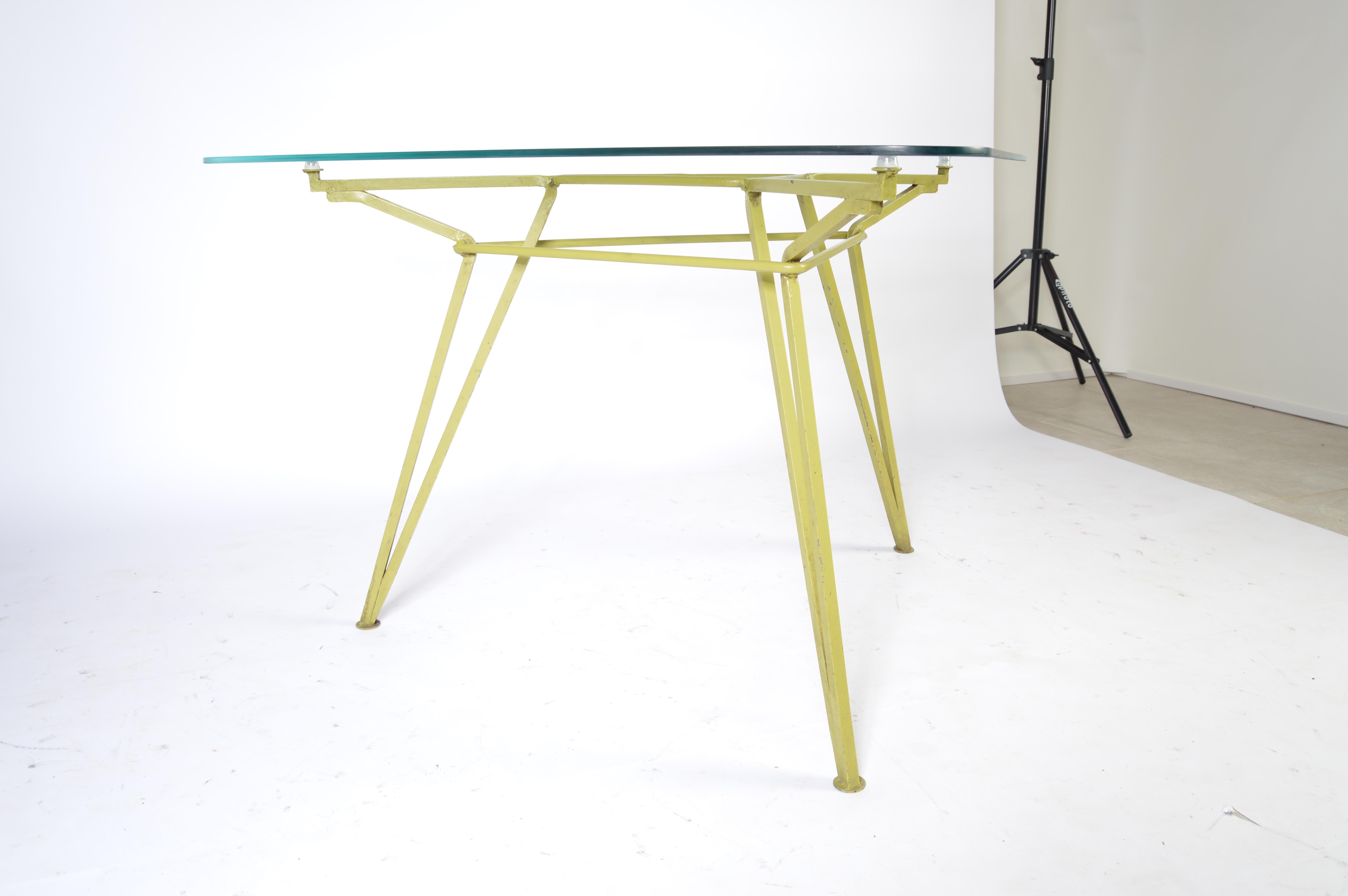 Geometrically shaped triangular iron table with glass top by Maurizio Tempestini. A stunning achievement in sculptural design, circa 1955.