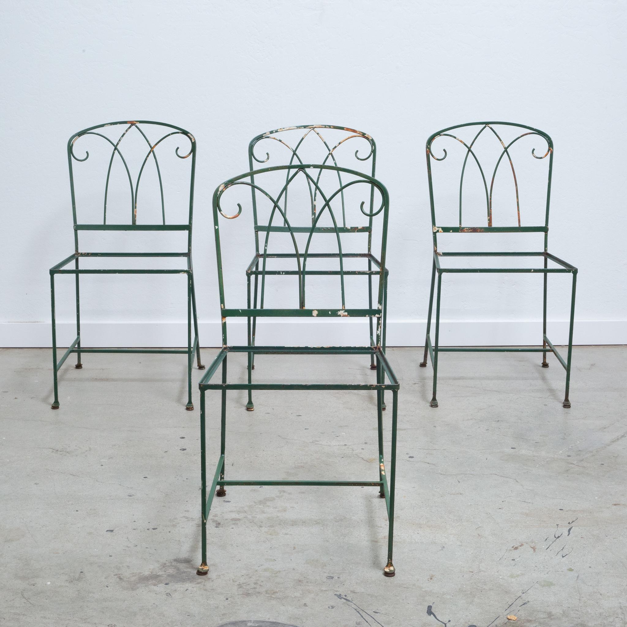 About
A set of four matching 1940s hand-wrought iron chairs with original paint, welded construction, scrolled backs and slender legs with curved feet.



 Creator: Maurizio Tempestini for Salterini.
Date of manufacture: c.1940.
Materials and