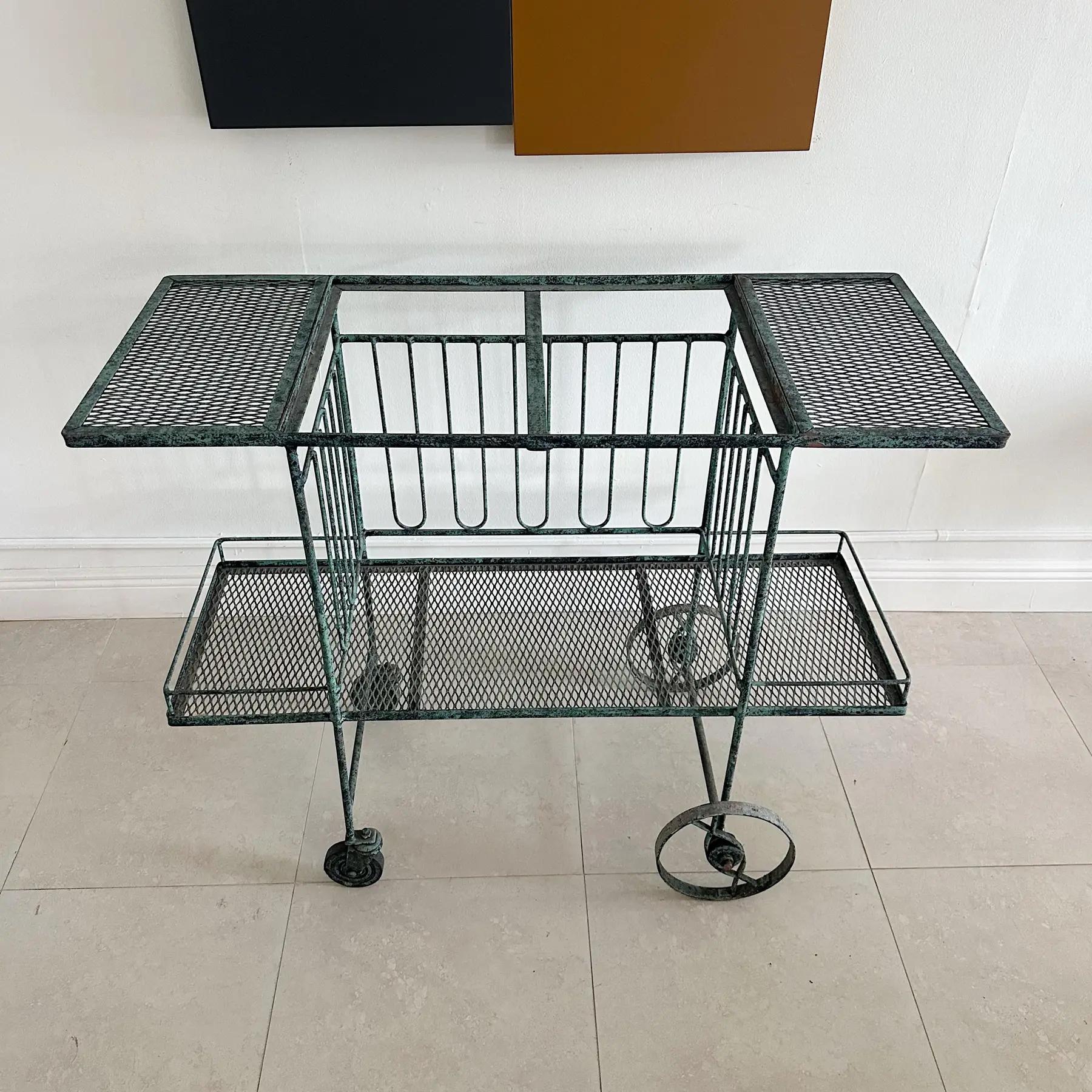 Maurizio Tempestini for Salterini wrought iron mid-century bar cart with vintage applied verdigris finish. Great vintage patina with slight wear and loss to some of the verdigris finish. As is with no glass to pick glass of your choosing. Glass spot