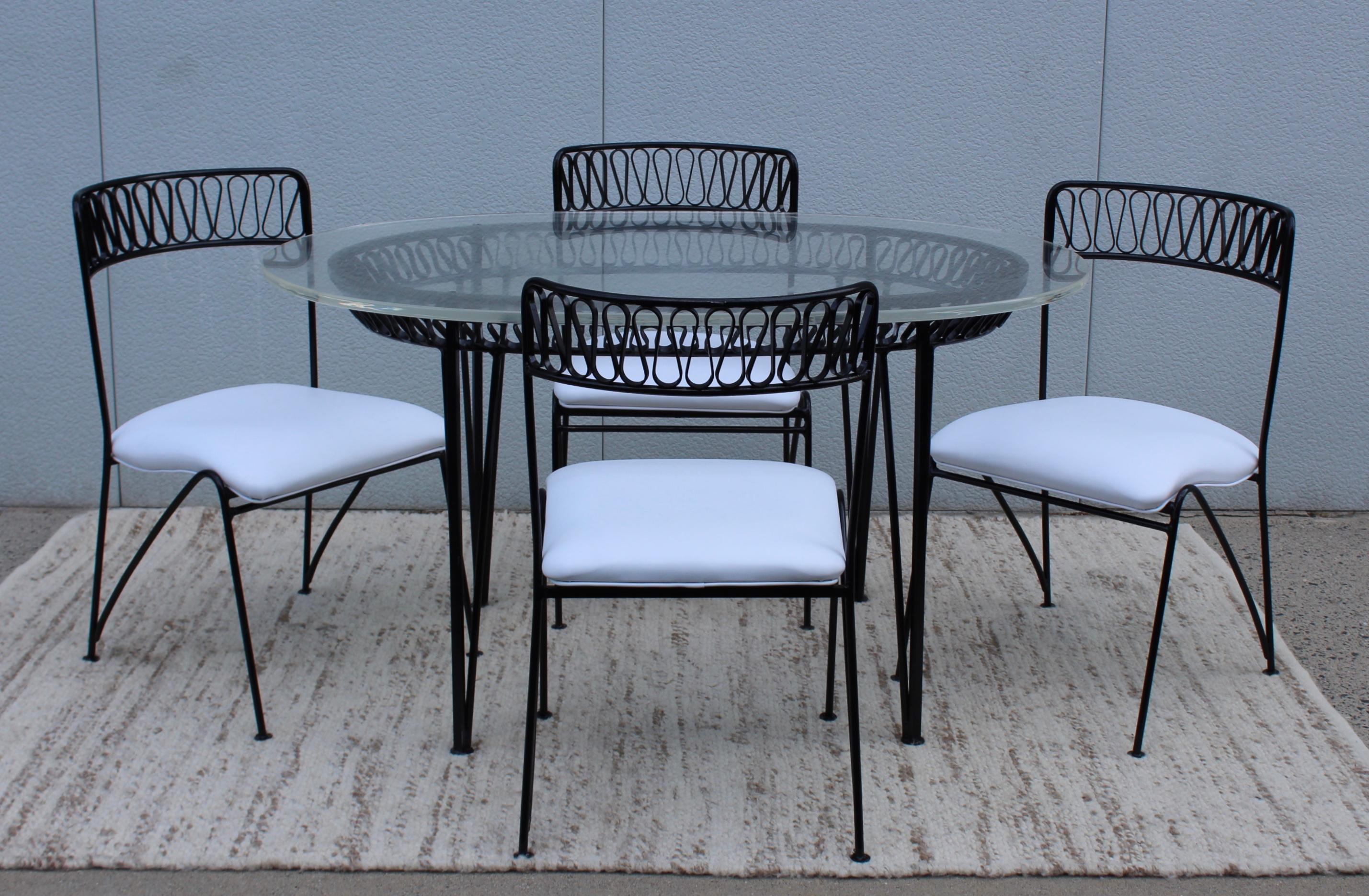 1950s Maurizio Tempestini designed for Salterini ribbon iron dining set, with custom-made Lucite top and new Naugahyde upholstery. 

Chairs measurements: width 19'', depth 21, seat 18'', height 33''.