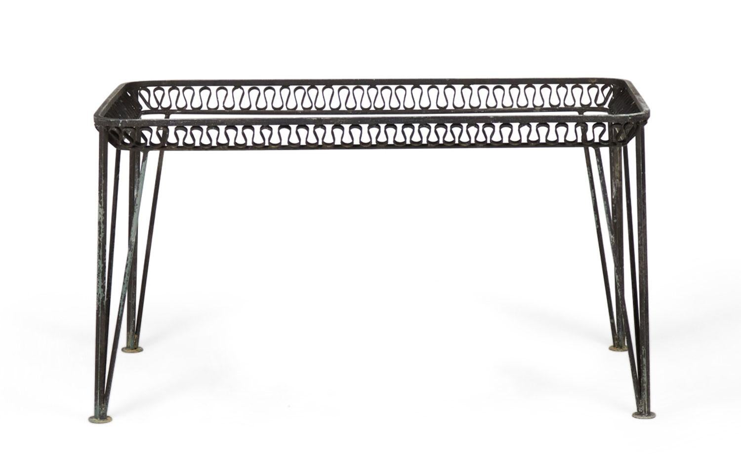American Mid-Century iron outdoor dining tables with rectangular frames with decorative ribbon design between two support rails resting on four hairpin legs (Missing glass top) (JOHN SALTERINI) (PRICED EACH)(Similar tables: DUF0164, DUF0168)

Frame