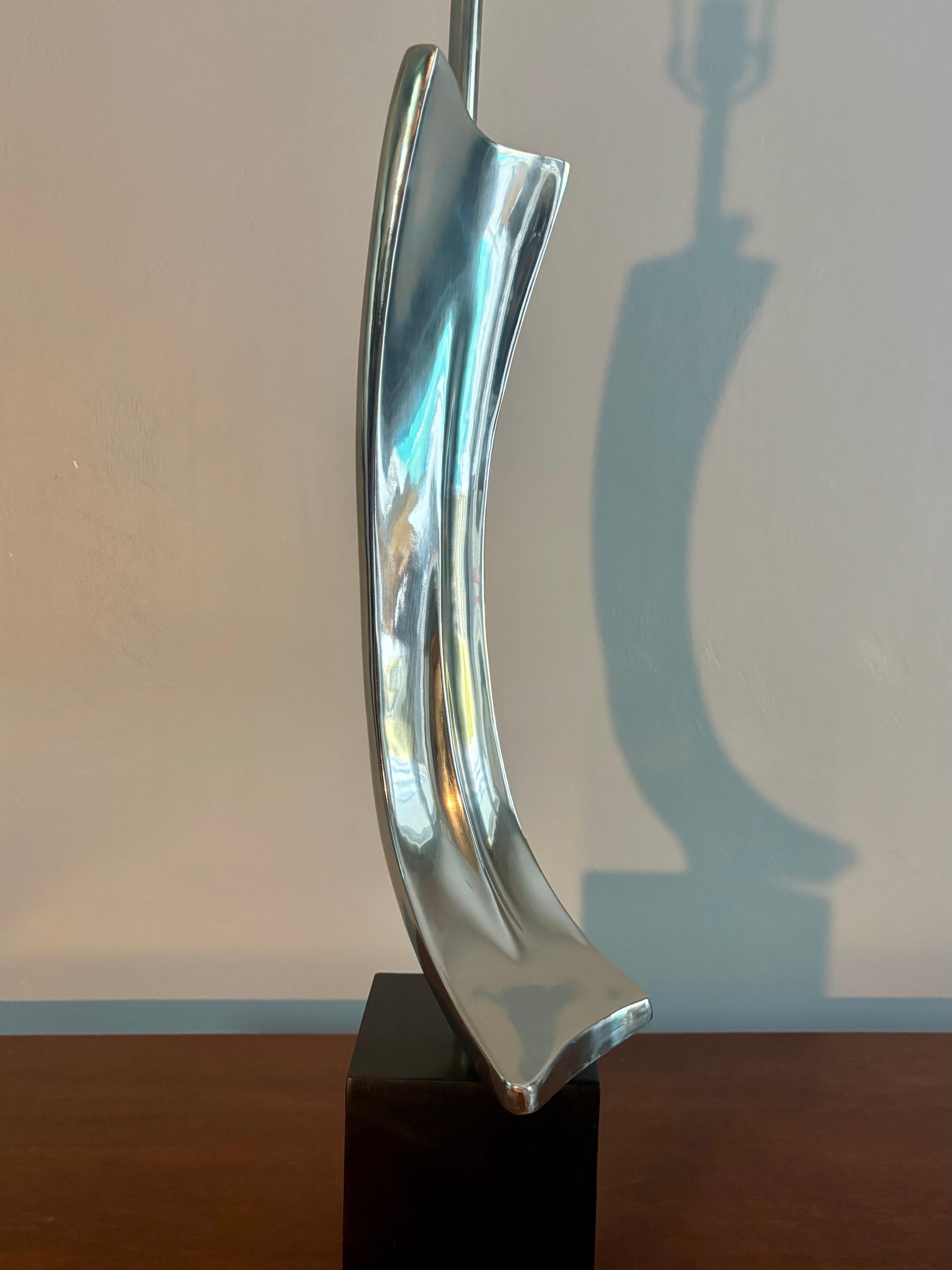 Maurizio Tempestini designed lamp for Laurel Lamp Company. Stellar abstract chrome sculpture sitting atop a black base. The curves and chrome provide beautiful light play with its reflection. Purchased from original owners who purchased from a show